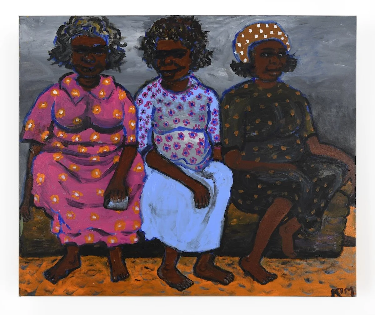 Aboriginal painting Three Ladies on a Log by Kunyi June Anne McInerney (2018). Depicts three Indigenous women in colorful dresses sitting on a log.