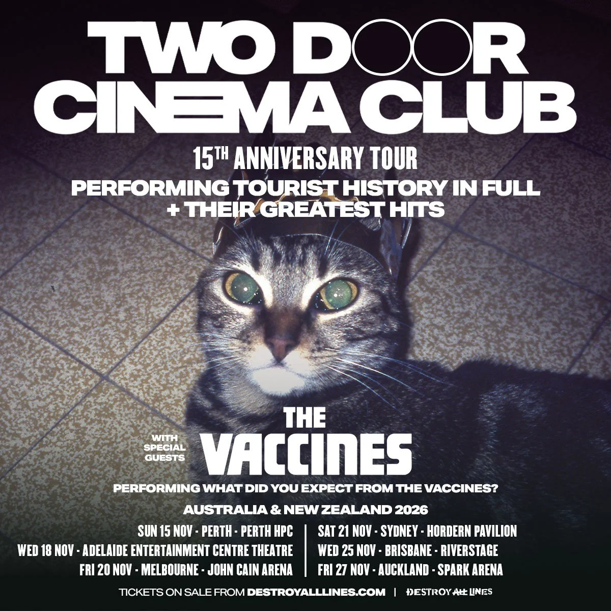 Two Door Cinema Club 2026 AU/NZ tour poster with The Vaccines. Features a cat in a crown and lists November dates for Perth, Adelaide, and Sydney.