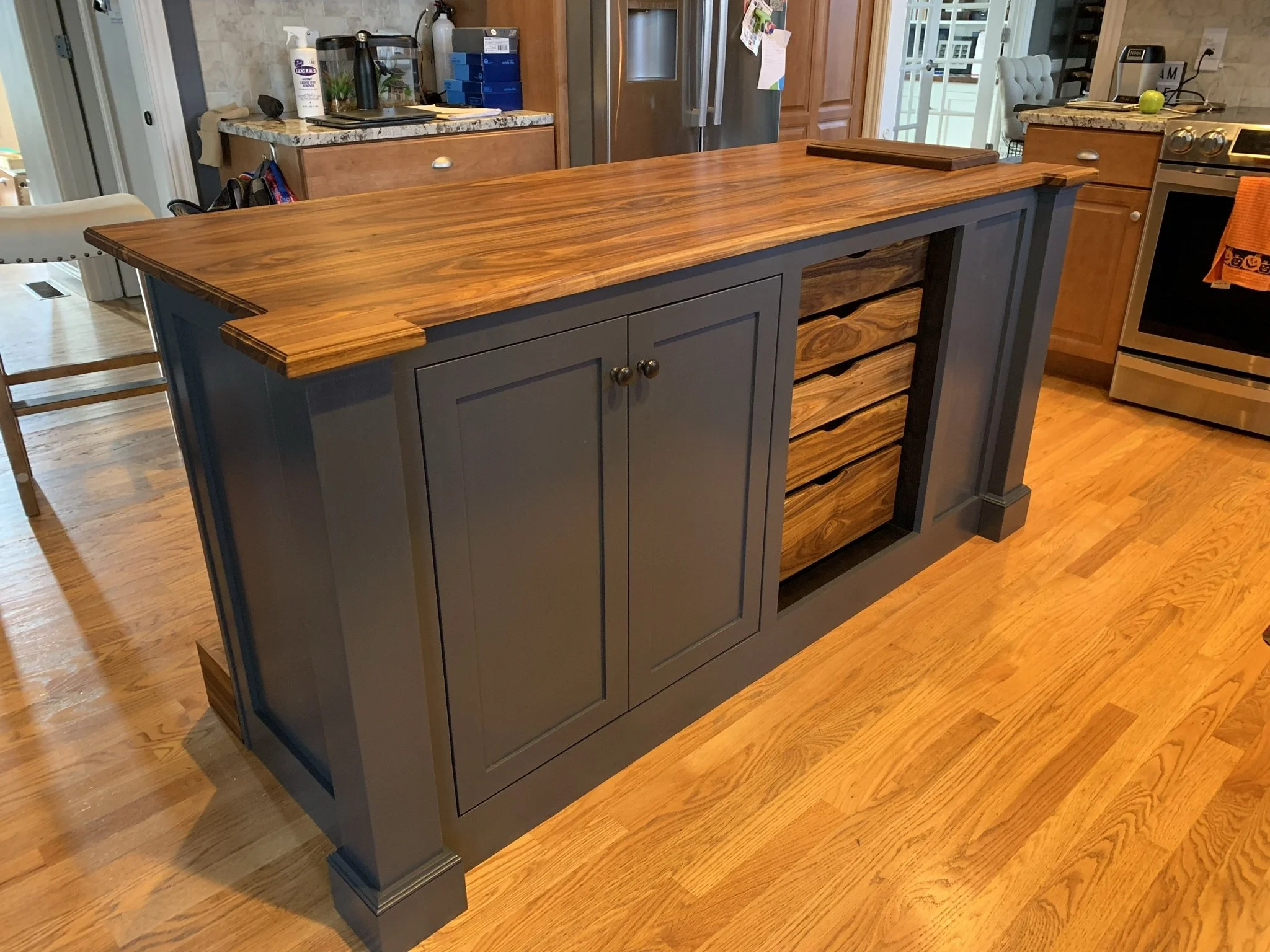 Kitchen island with Canary wood top and drawers, and a walnut butcher block.