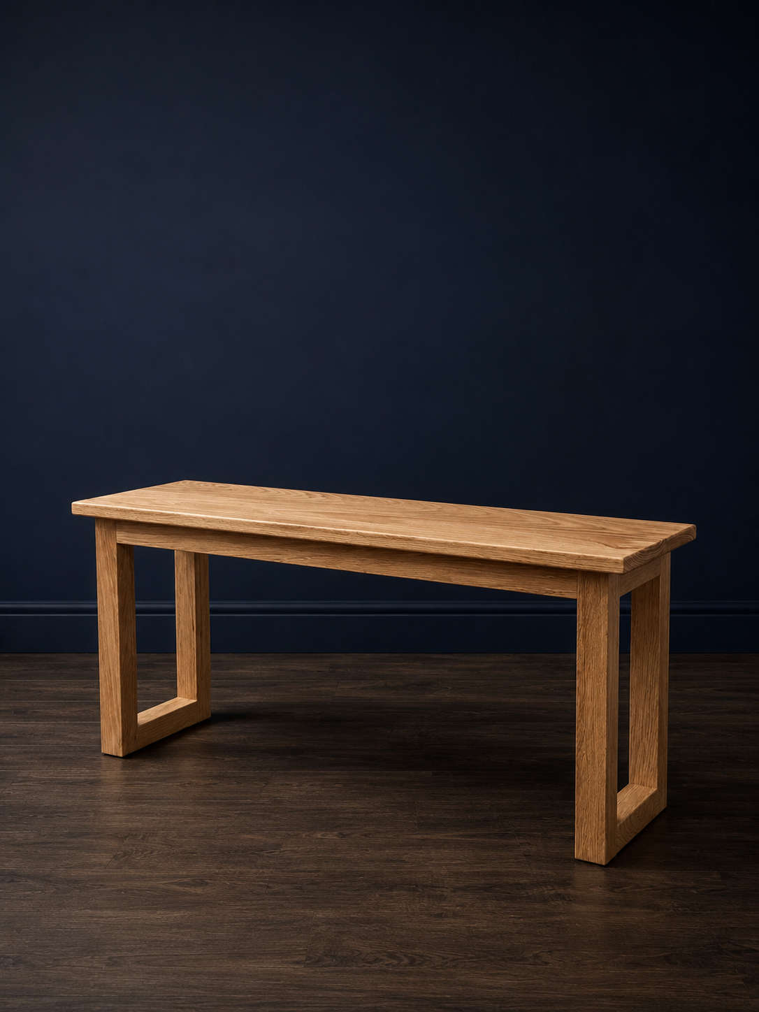 A simple yet elegant white oak bench, thoughtfully designed and built to fit a unique space in a New England home. Paired with a matching console bench, shown in the next photo.