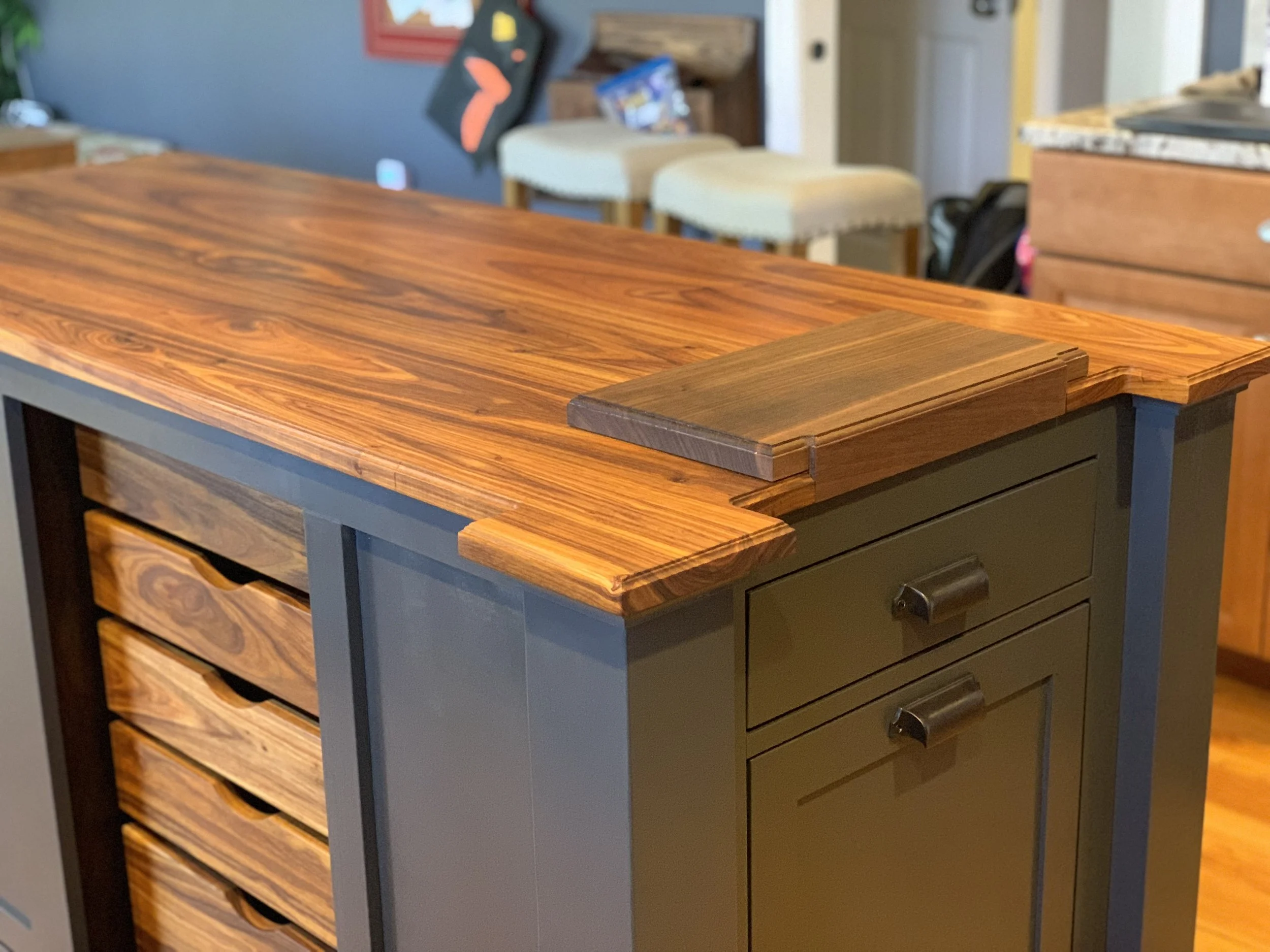Kitchen island with Canary wood top and drawers, and a walnut butcher block.