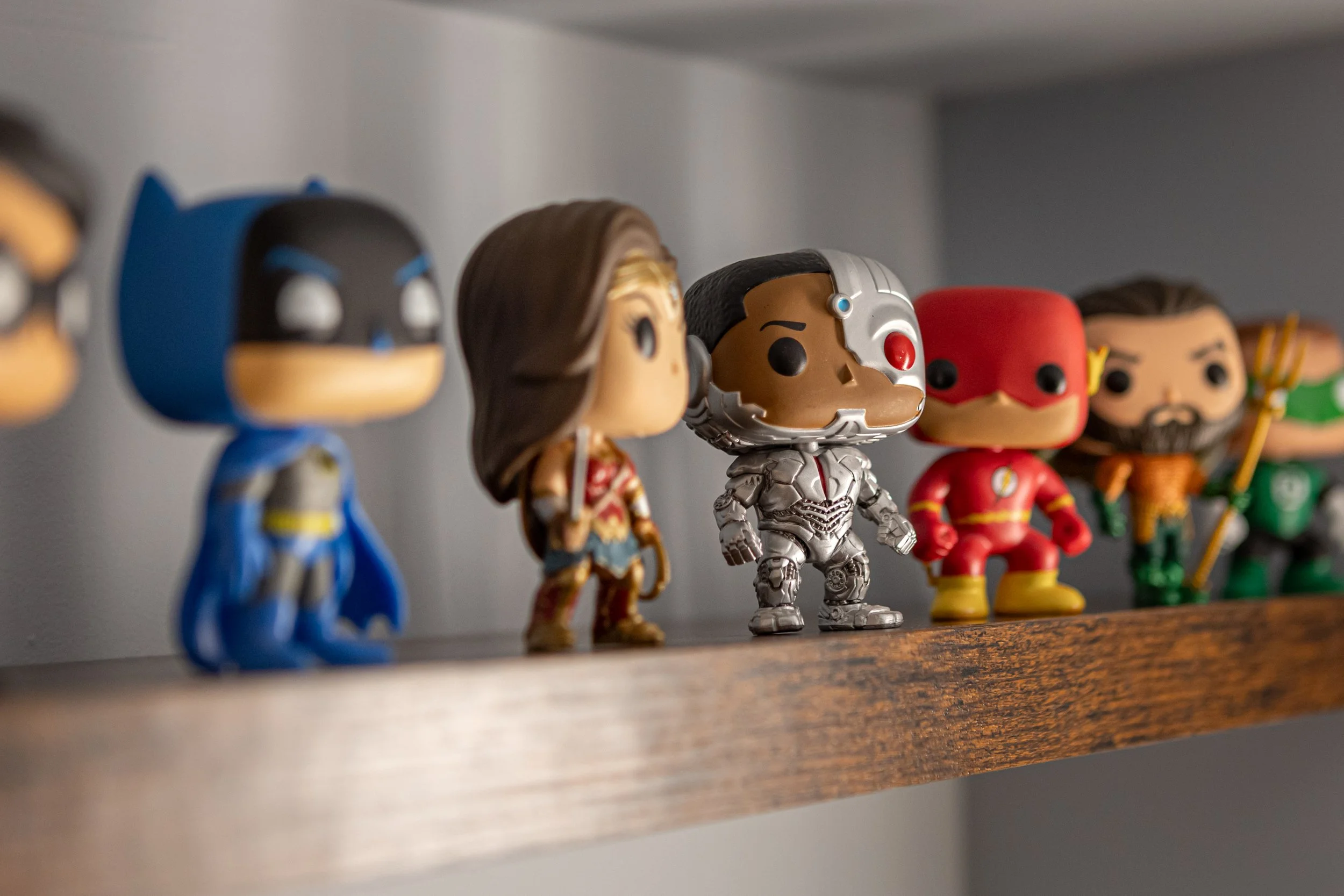 Close-up of client collectibles styled within custom open storage in Toronto Ontario, Project Ten Forward by Inspired Spaces Design Studio