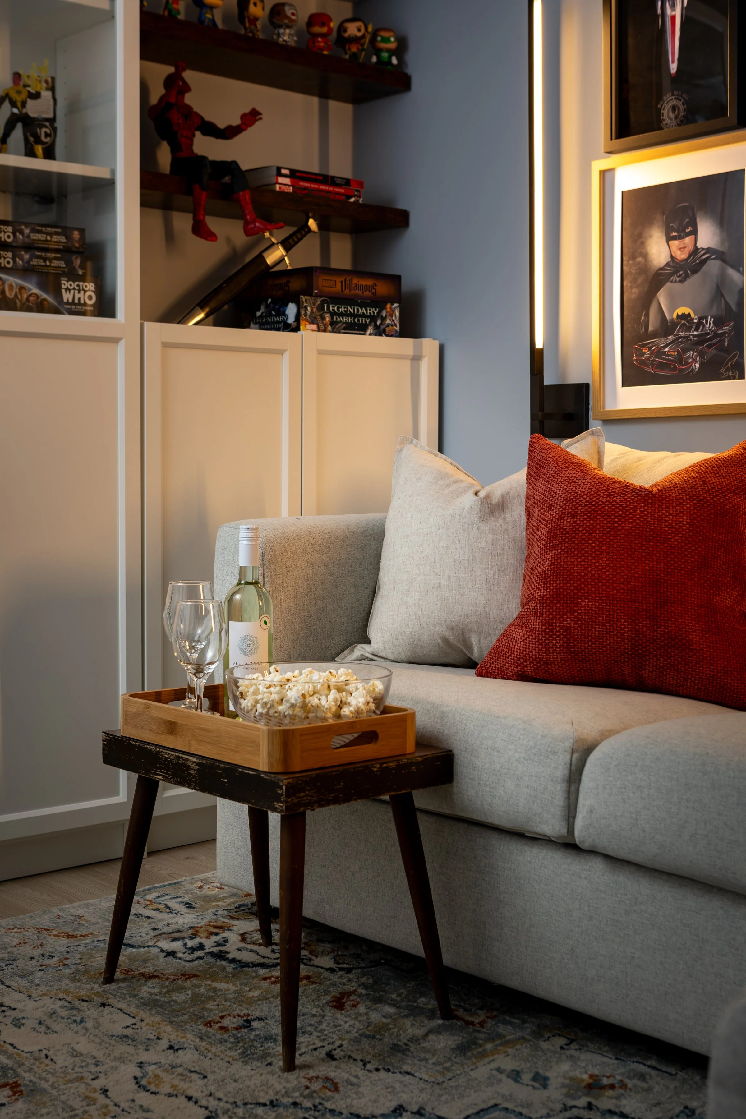 Living room with gallery wall, open and closed display storage, and media wall with wood slat feature in Toronto Ontario, Project Ten Forward by Inspired Spaces Design Studio