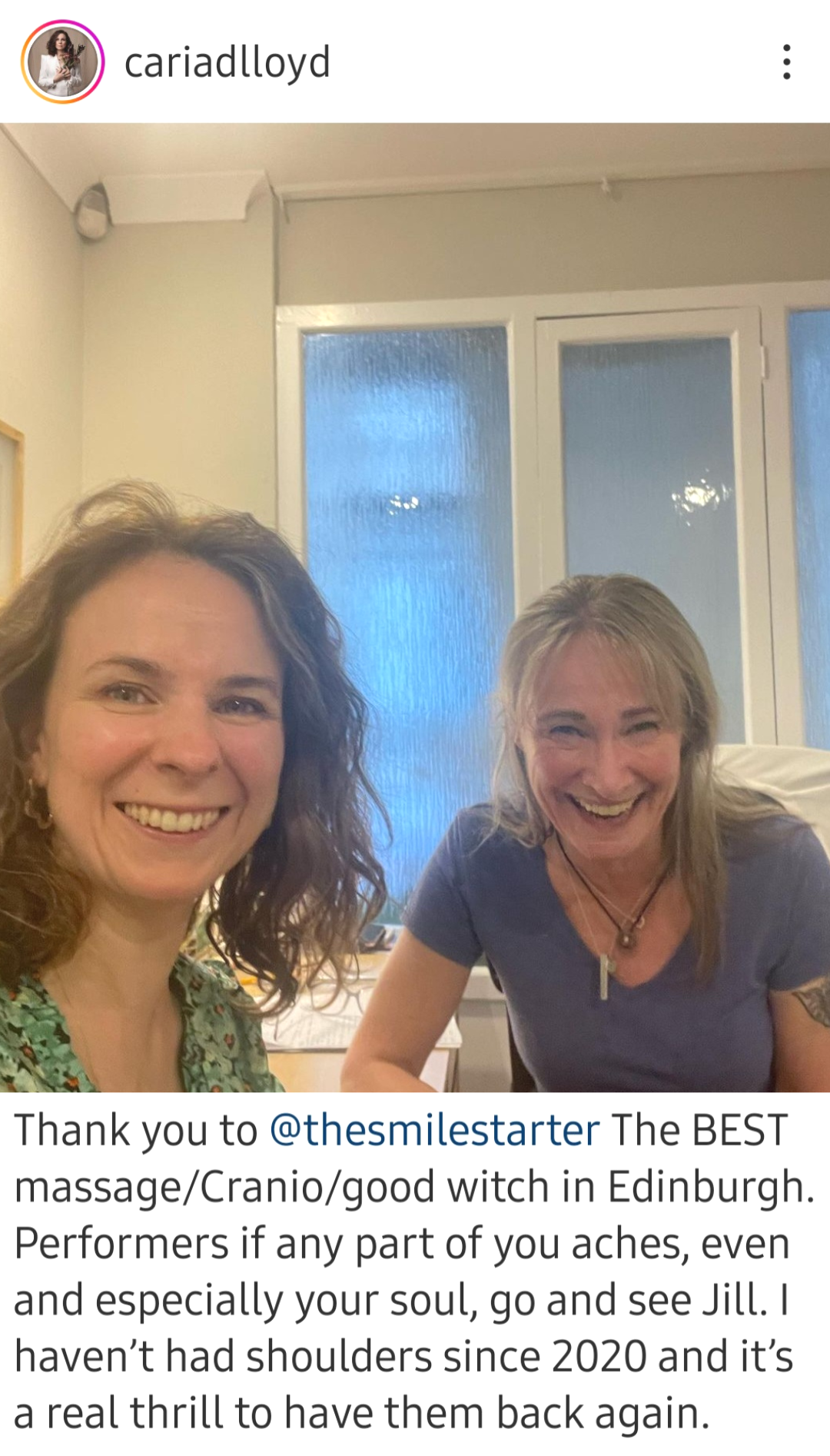 Image shows Jill and Cariad at a desk, after the treatment, smiling at the camera for a selfie. Jill is wearing a blue T-shirt, Cariad is wearing a pale green blouse with small red roses on it.