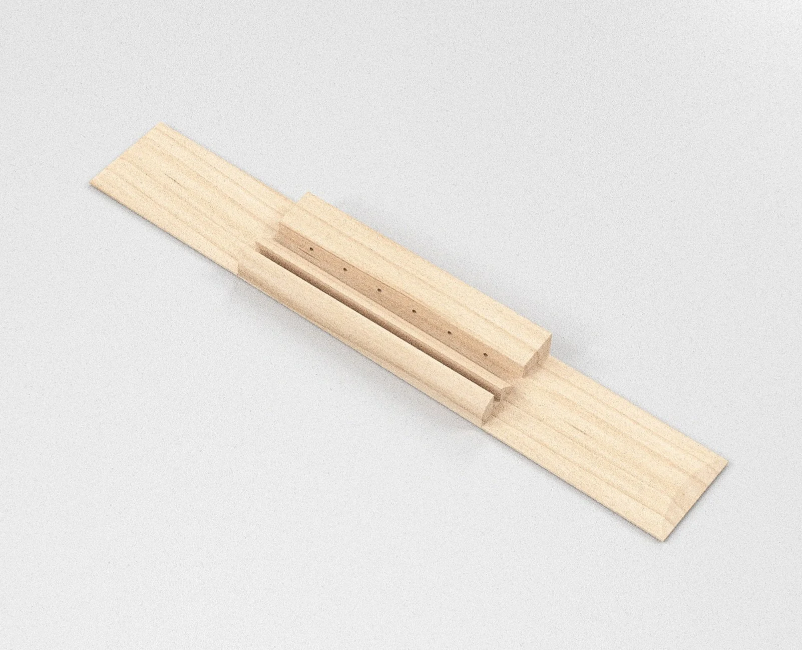 Un chevalet de guitare en bois clair