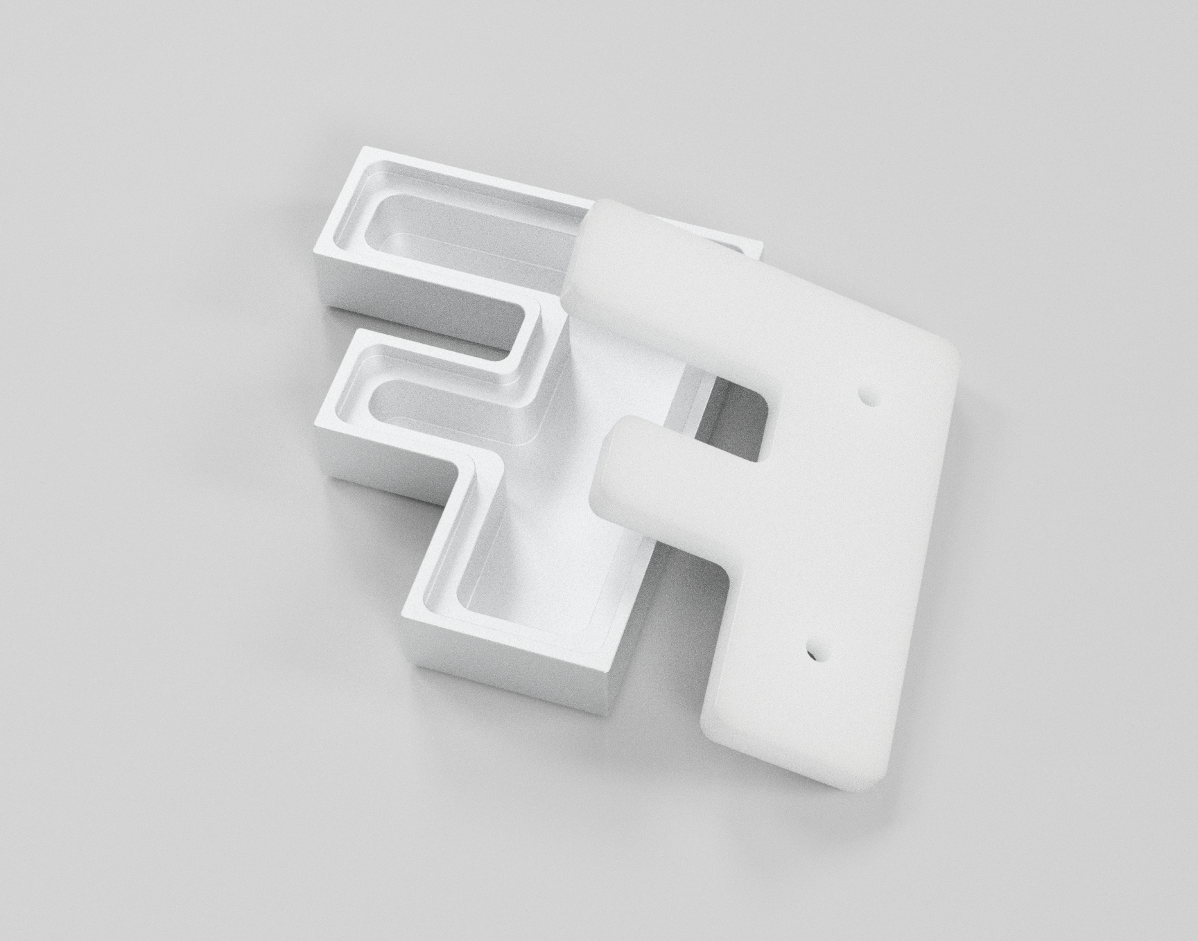 Une signalétique en forme de lettre 'F' stylisée, blanche, avec des parties creuses, vue de dessus.