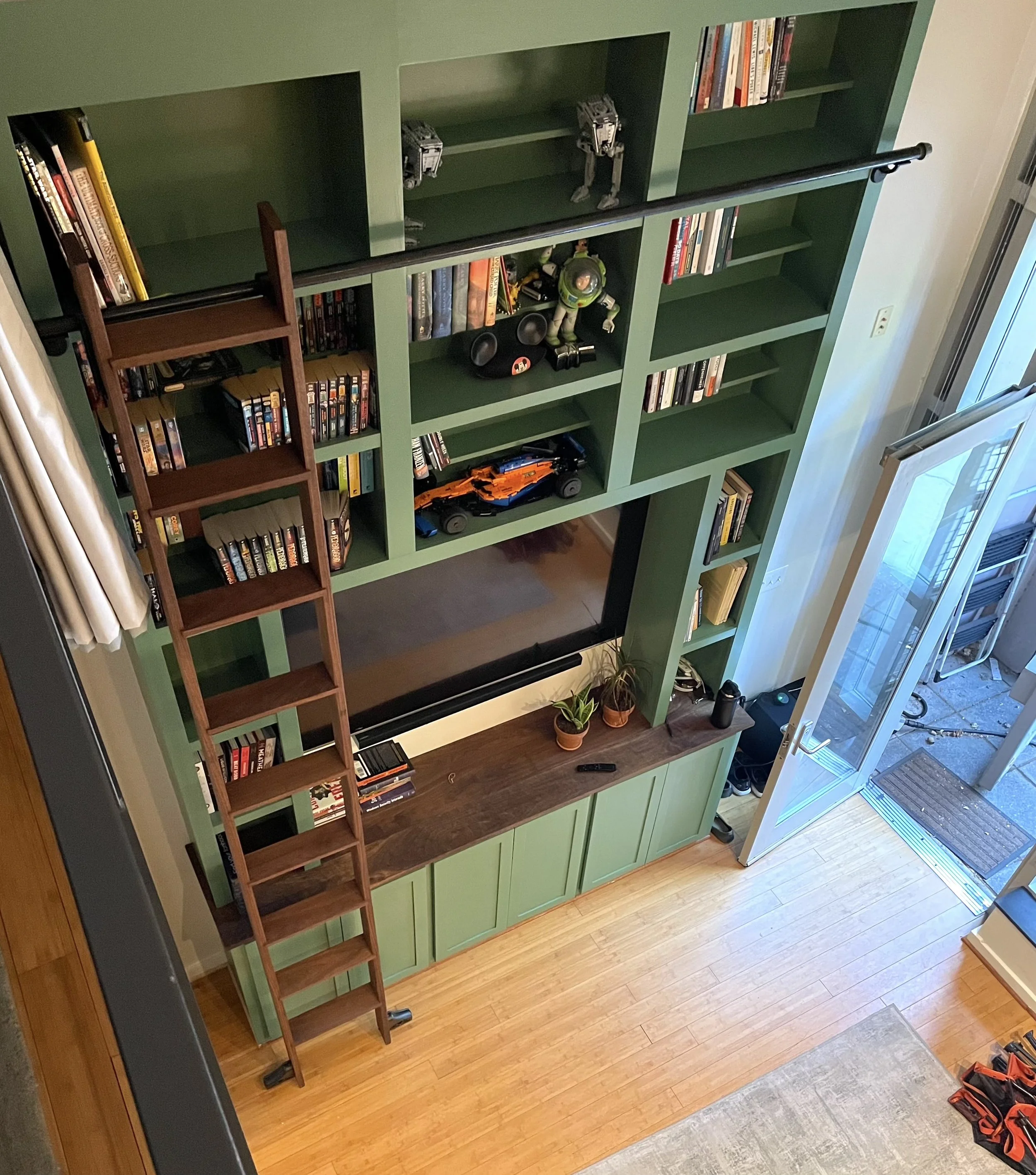 12' library with rolling walnut ladder