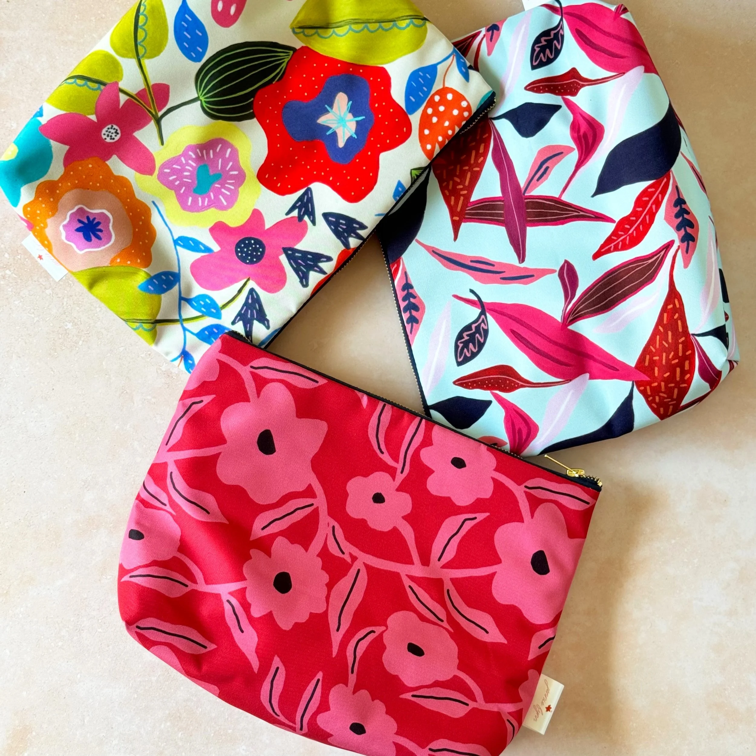 3 vibrant colourful patterned women's toiletry bags by Jennie Fynn