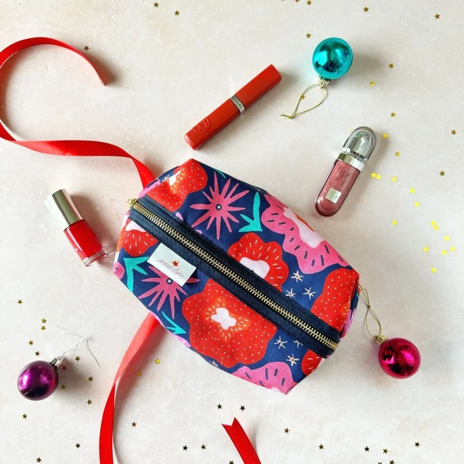 Brightly coloured red pink orange and blue large makeup bag UK by Jennie Fynn