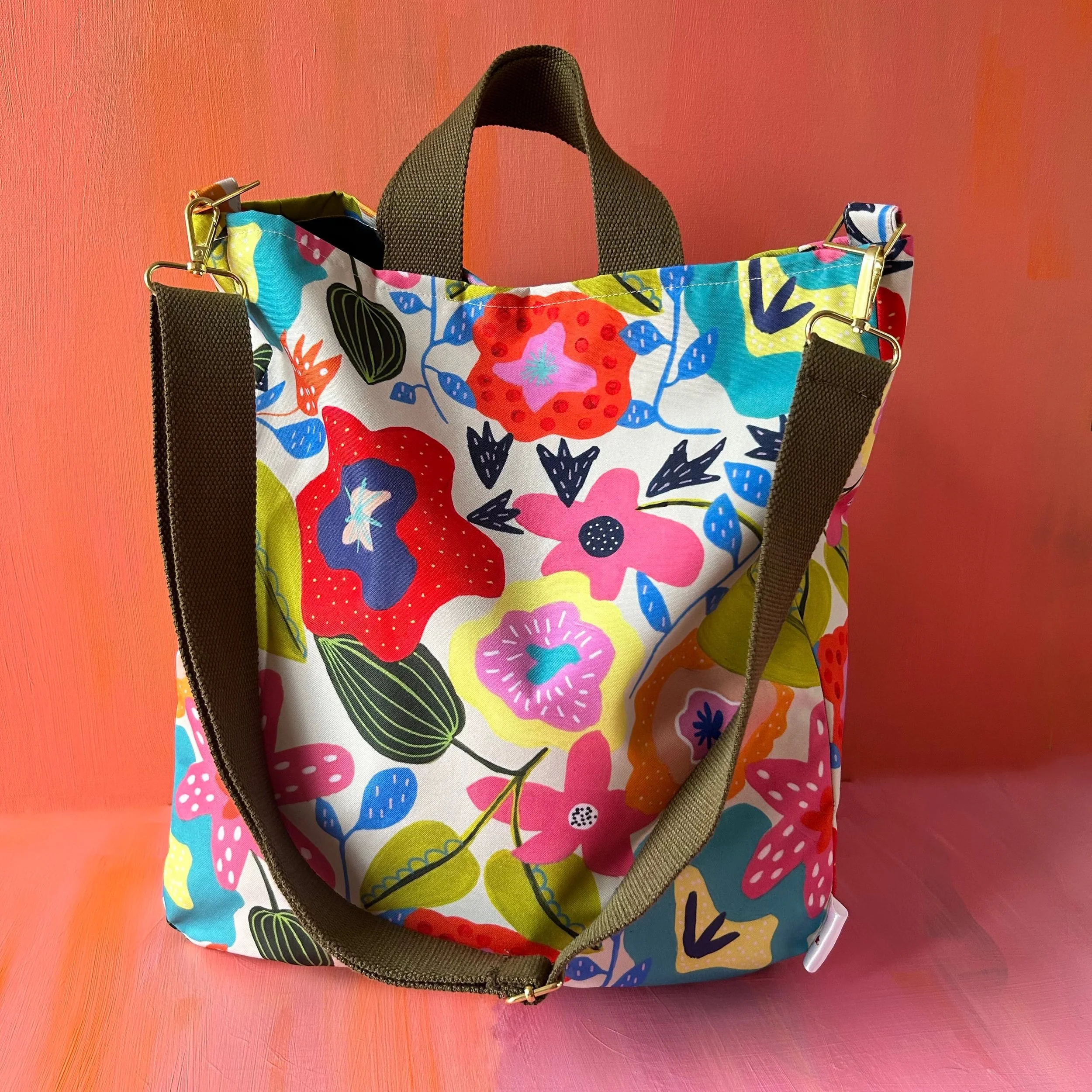 Bright colourful floral cross-body tote bag in waterproof fabric khaki webbing handles designed by Jennie Fynn