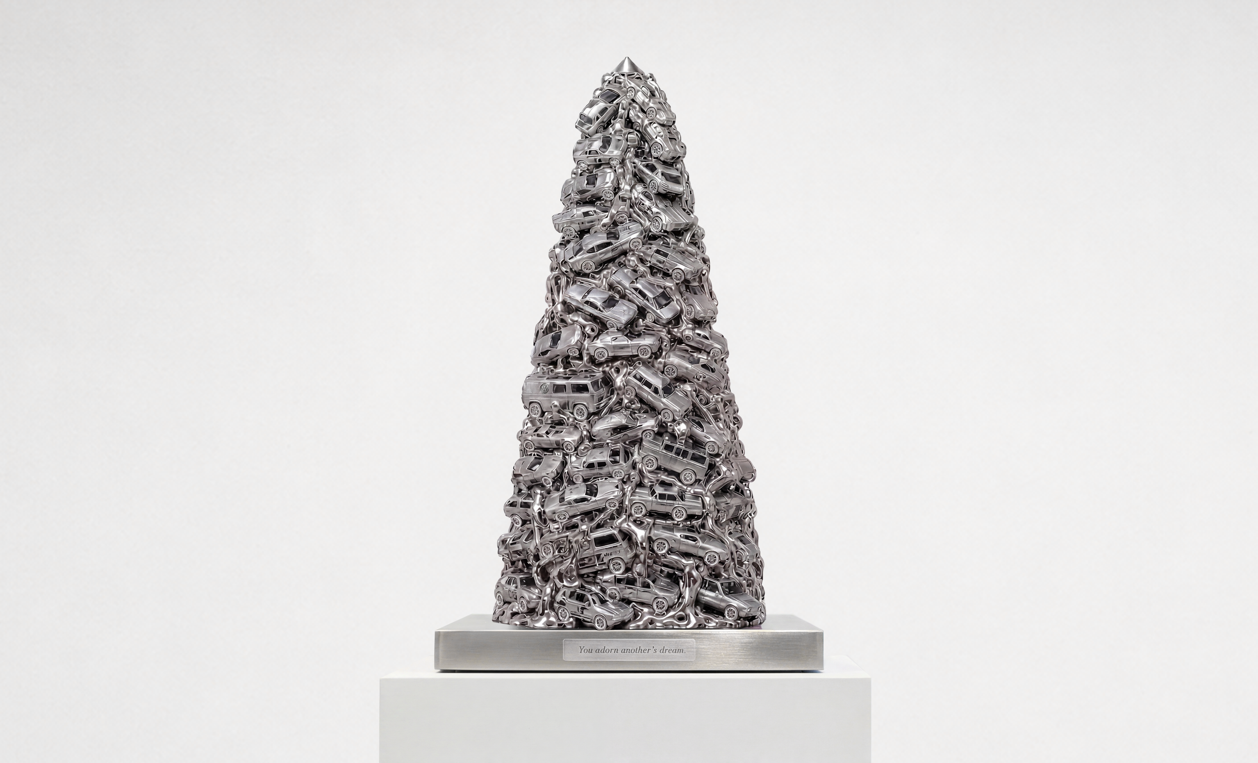   The Surrogate Monument , 2026, welded diecast model cars, stainless steel, 23.1 × 11.2 × 11.2 inches 