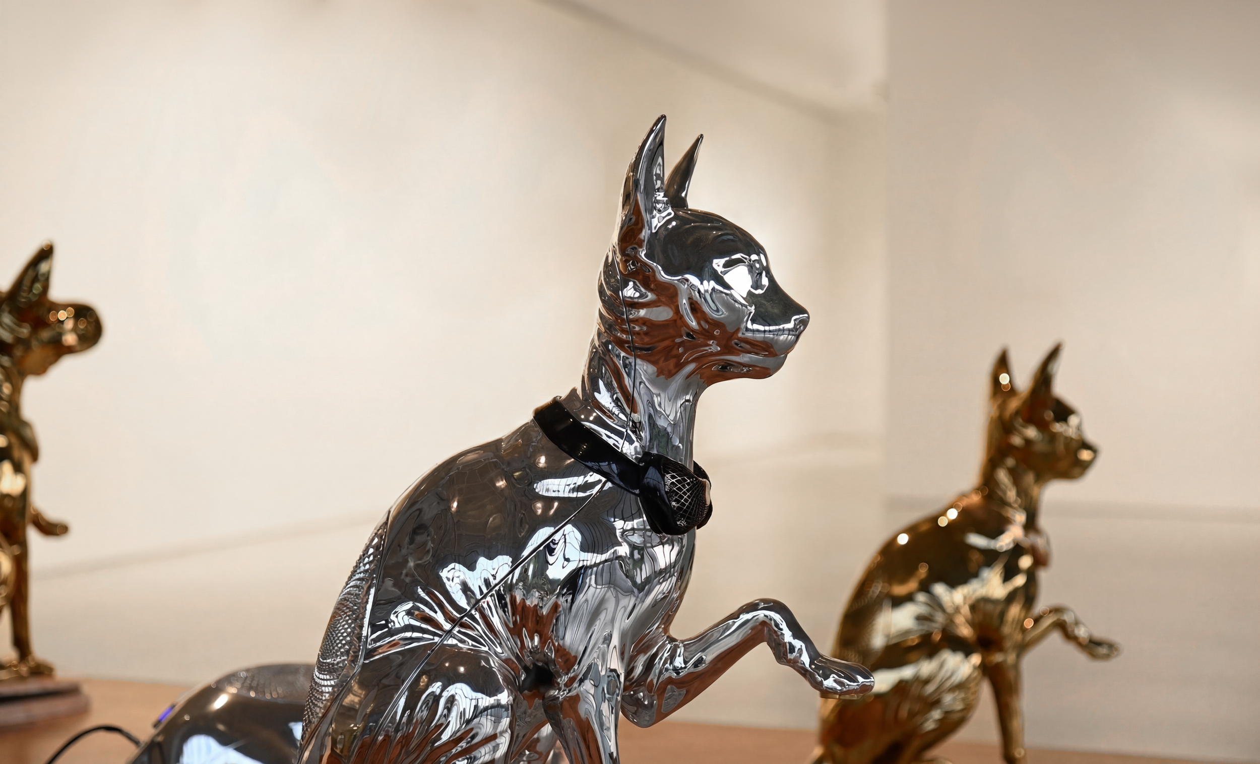   Mission on Mars , 2022, interactive installation with sound, fiberglass, sphynx-cat-shaped speakers, steel-aluminum arms, dyed tree, sensors embedded in dyed soil, 227.5 × 244.5 × 143.7 inches 