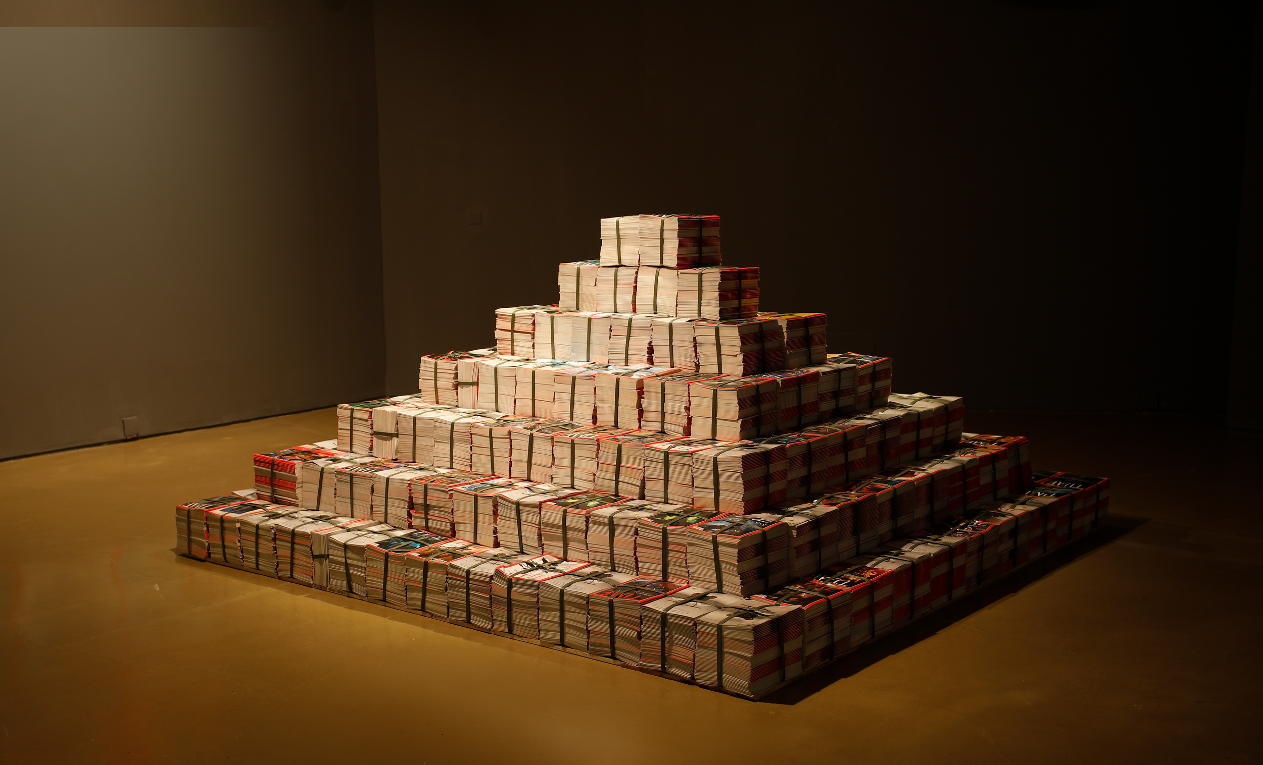   Virtual Magazine , 2017, installation of bulk-printed magazines with redesigned TIME covers and content, 110.2 × 107.6 × 84.2 inches 