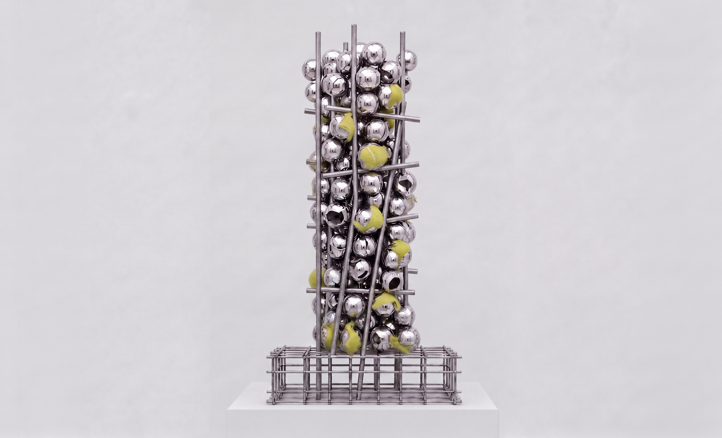  The Pressure Monument,  2026, Chrome-plated balls, tennis balls, welded stainless steel rebar, 34 × 14 × 11 inches 