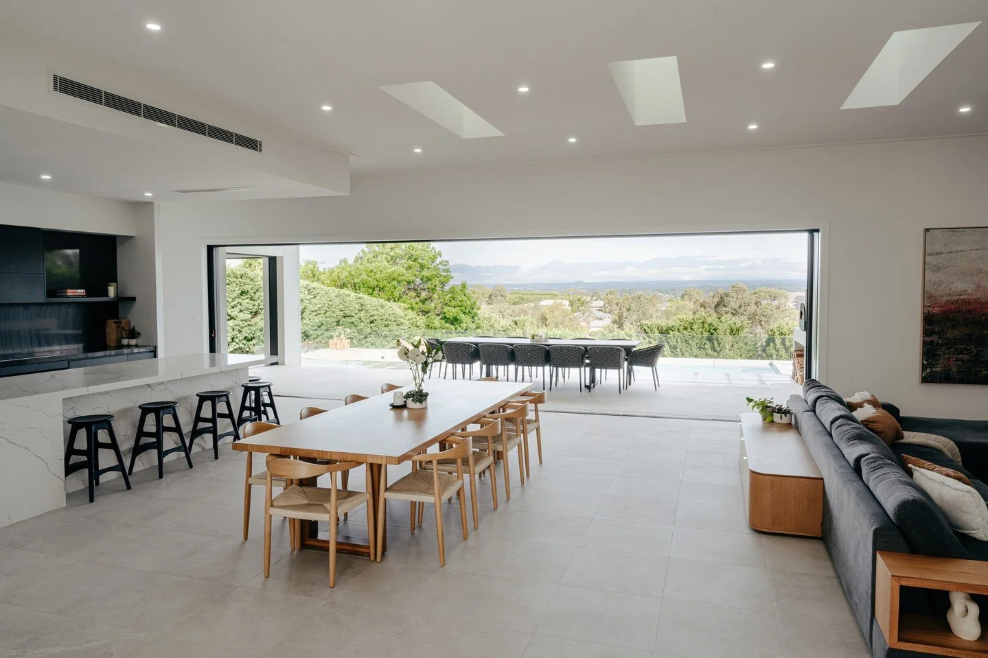 You might remember this beautiful family home we built, designed with generous foldable windows to bring the outdoors in. ⁠
⁠
Seeing it now, furnished and filled with family life, is incredibly special. This space has truly become a home - an enterta