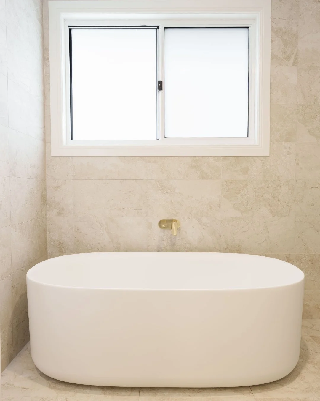 Luxury bathrooms are always a joy for us to create. We love designing spaces that give our clients a true retreat, a place to relax and unwind in the comfort of their own home.⁠
⁠
We're especially loving these premium natural stone finishes paired wi