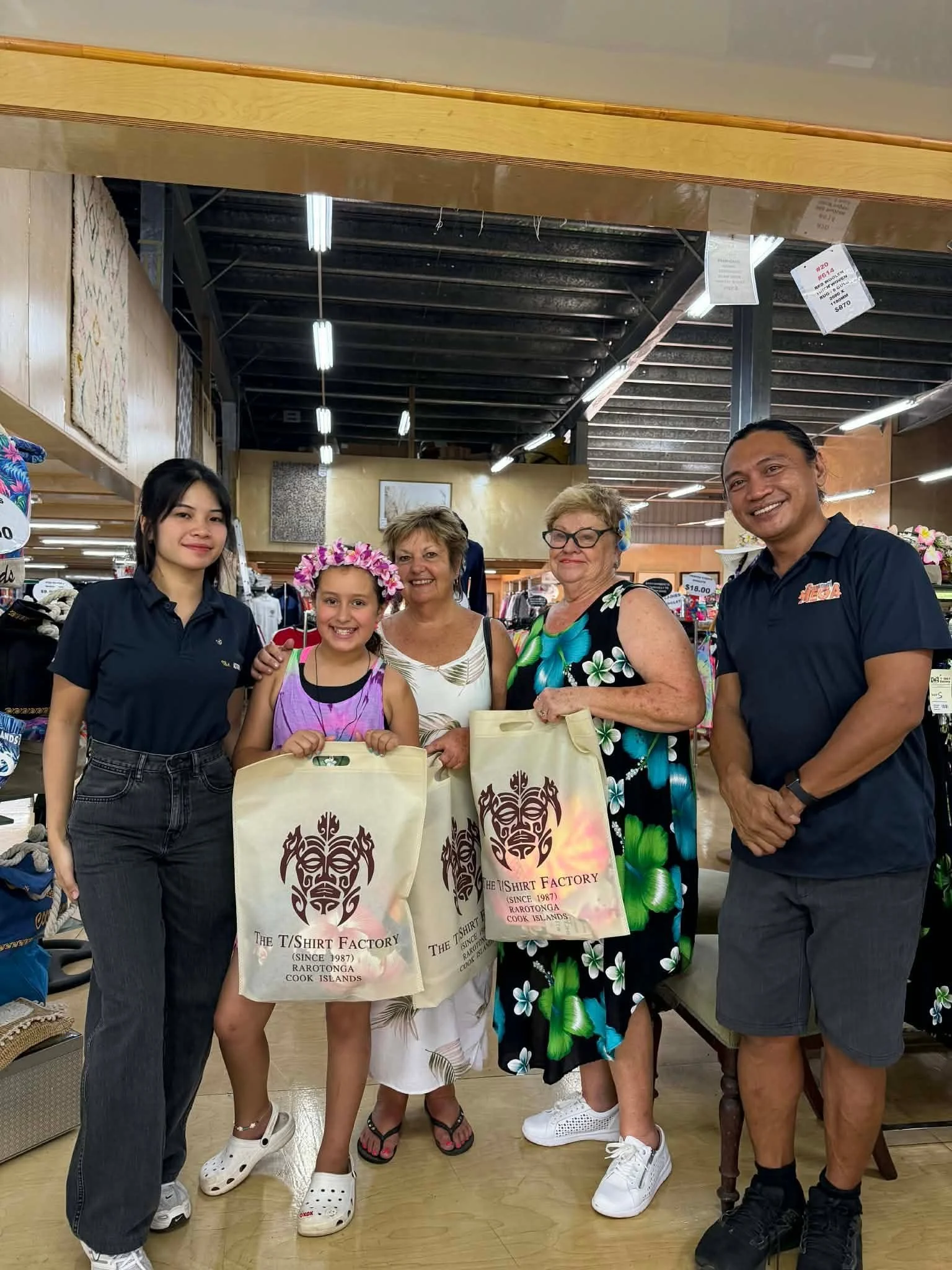 Visitors shopping for Cook Islands clothing and souvenirs at the T-Shirt Factory in Rarotonga.