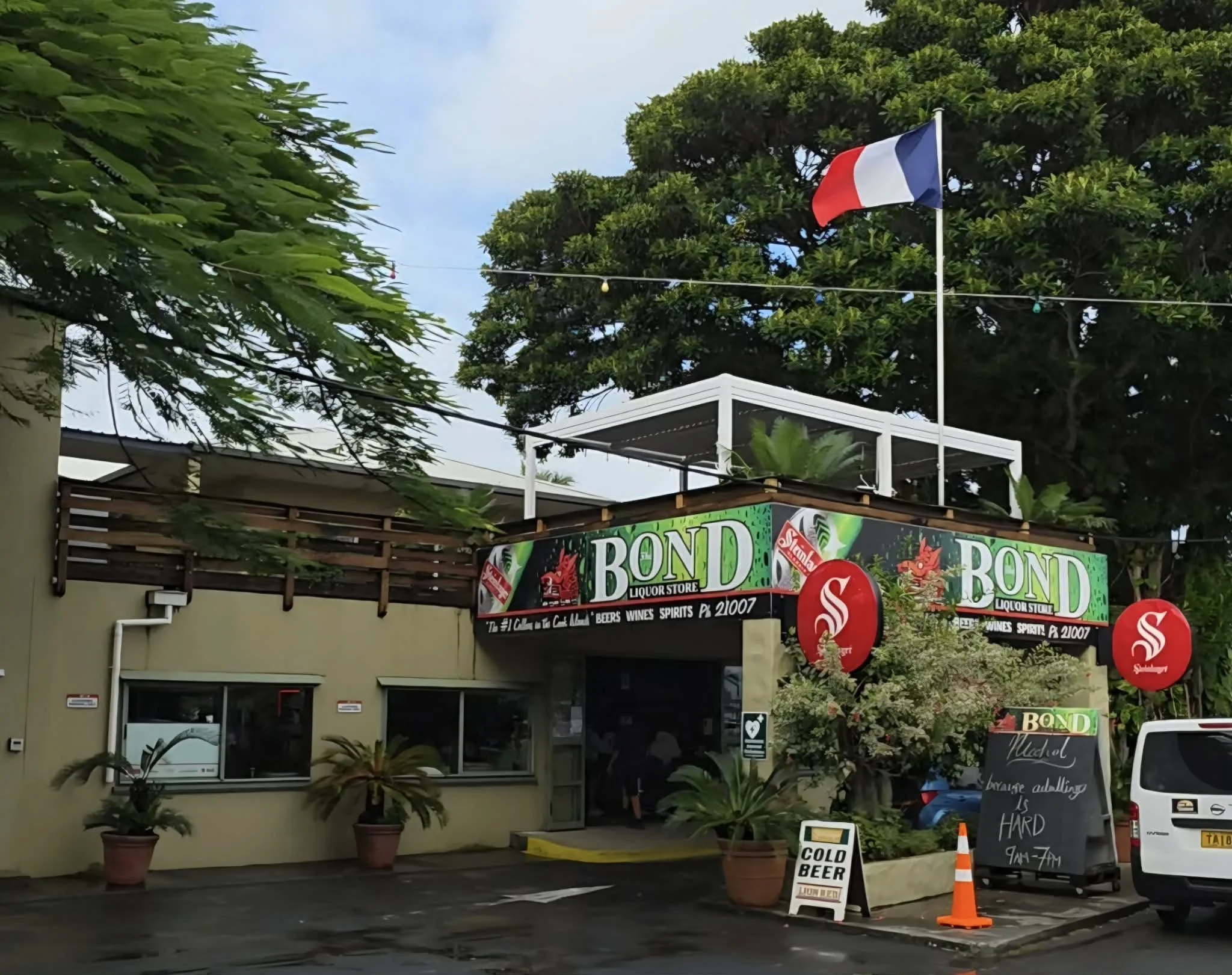 Visitors shopping at The Bond Store for wines, spirits and local products in Rarotonga, Cook Islands.
