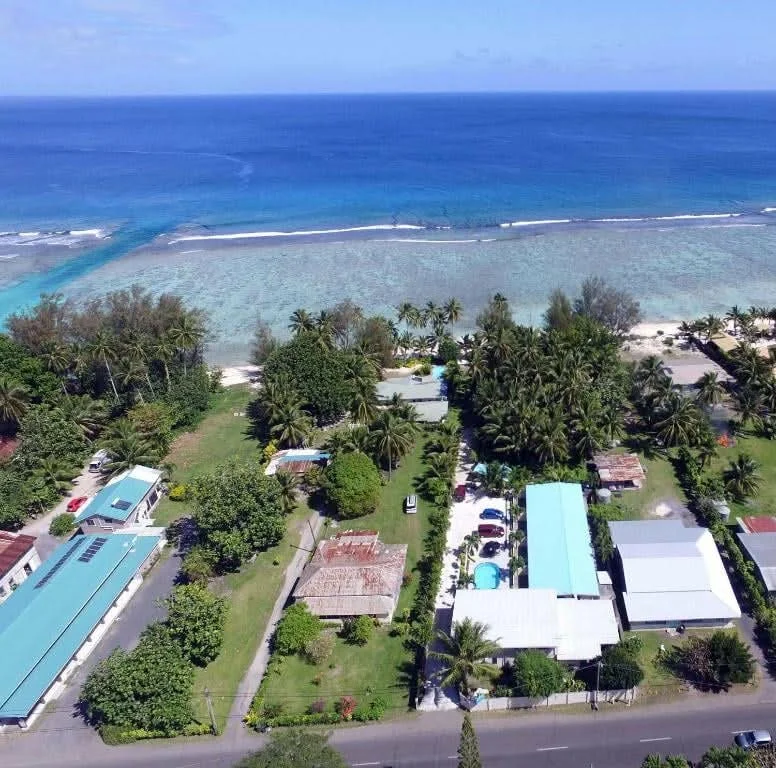Aerial view of Coral Sands Apartments in Arorangi, Rarotonga, just a short walk from the beach and surrounded by tropical gardens.