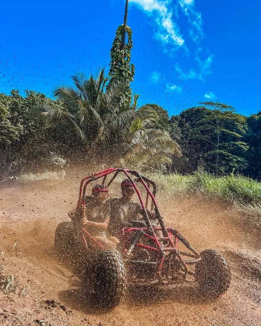 Guests enjoying an off-road adventure with Raro Buggy Tours in Rarotonga, Cook Islands.