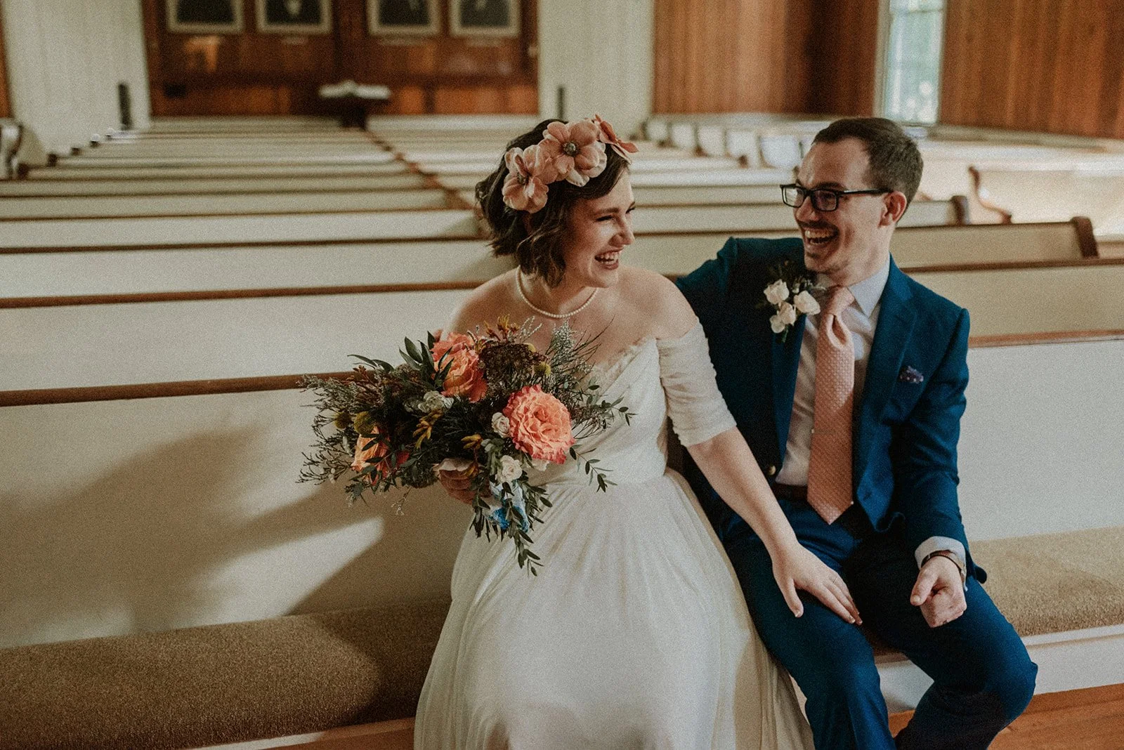 Laurie’s customers, Fernando and Kate embracing by the lake on their wedding day.