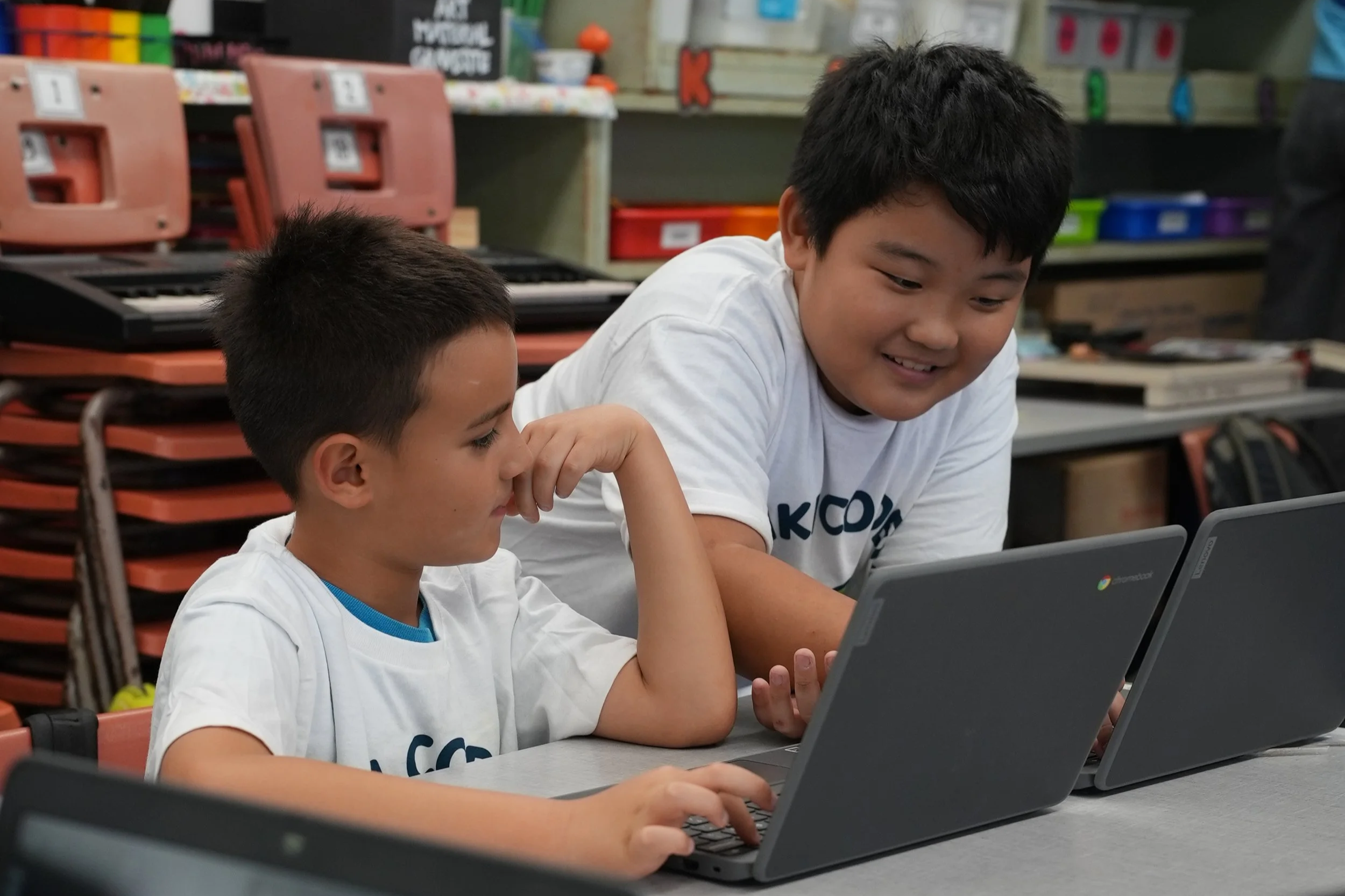 Kids coding on laptops in class in O'ahu