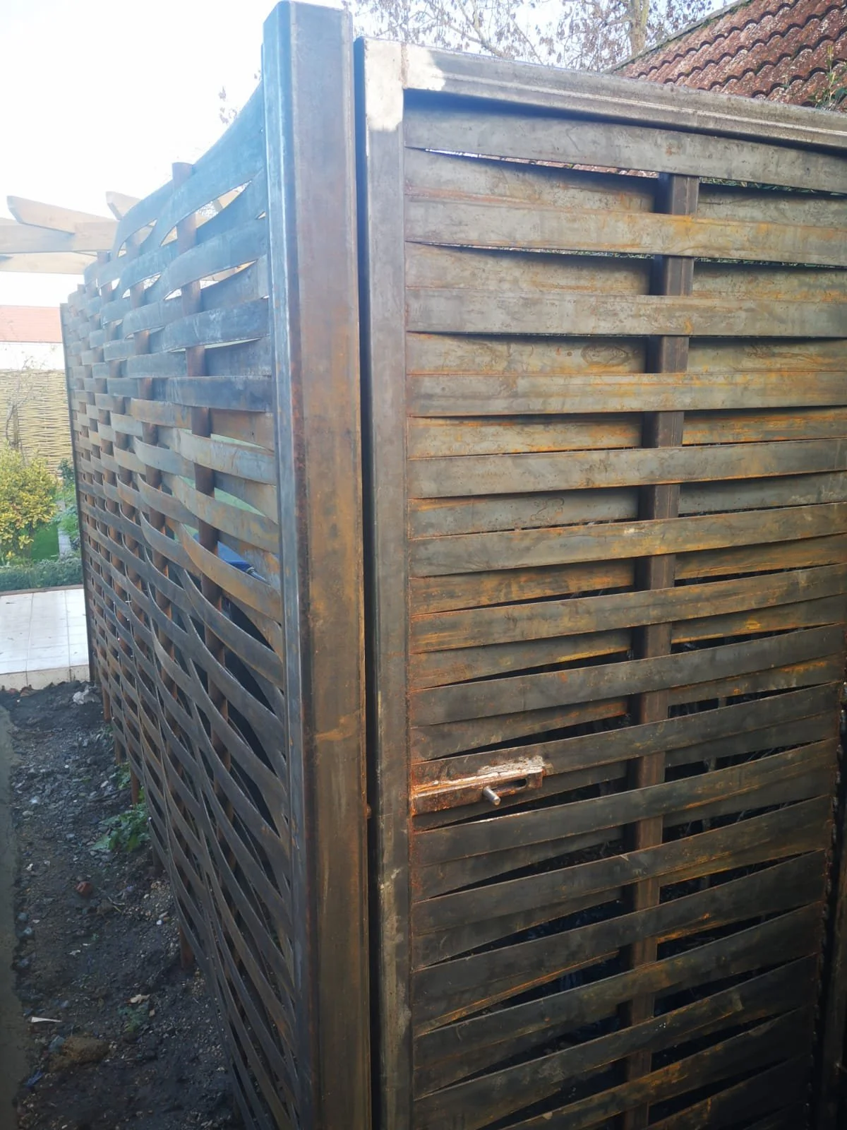 A woven metal panel with woven metal gate, and lock