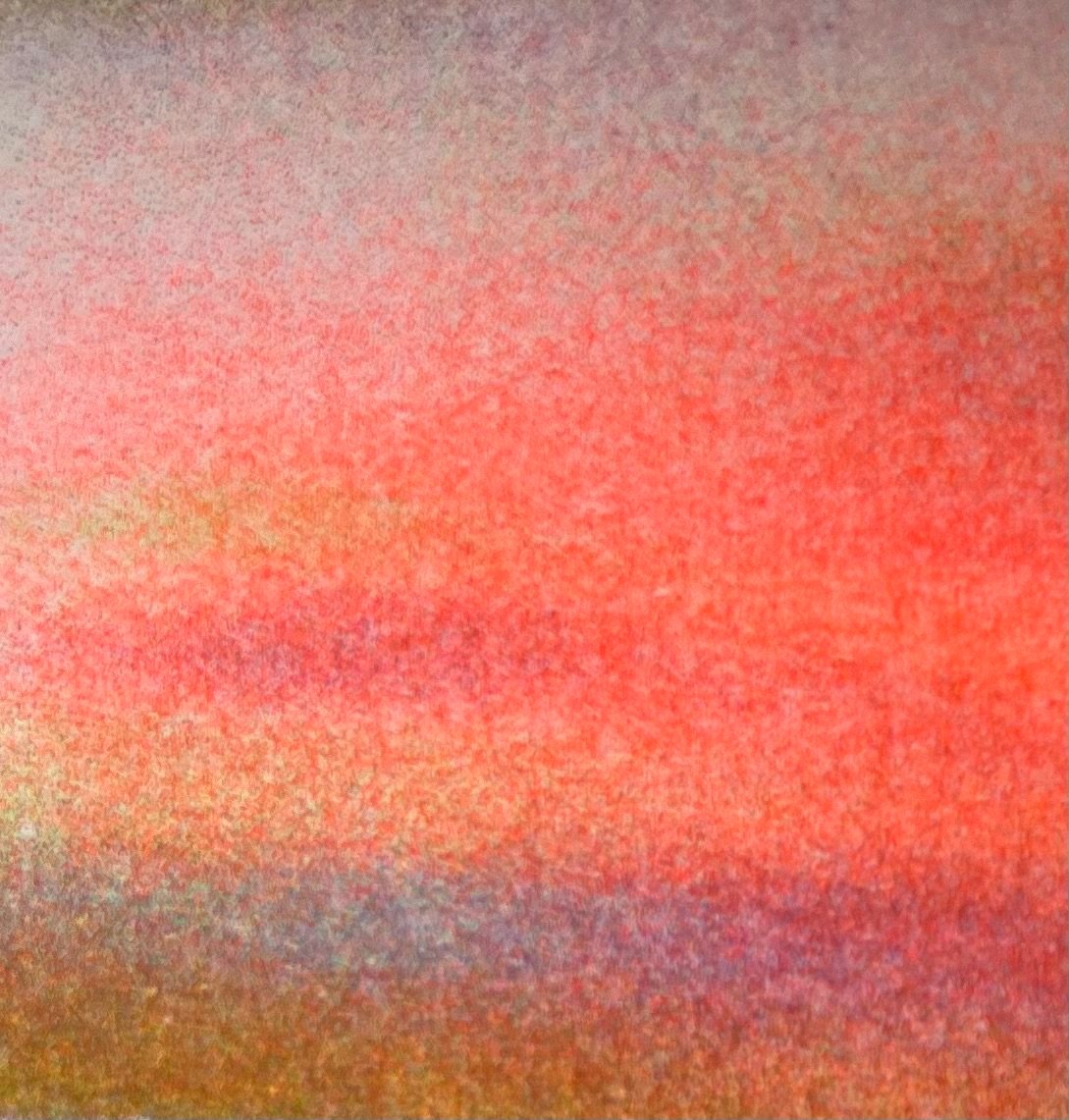 Nahaufnahme eines bunten, strukturierte Oberflächen mit rosa, orange, gelb und blauen Farbverläufen.