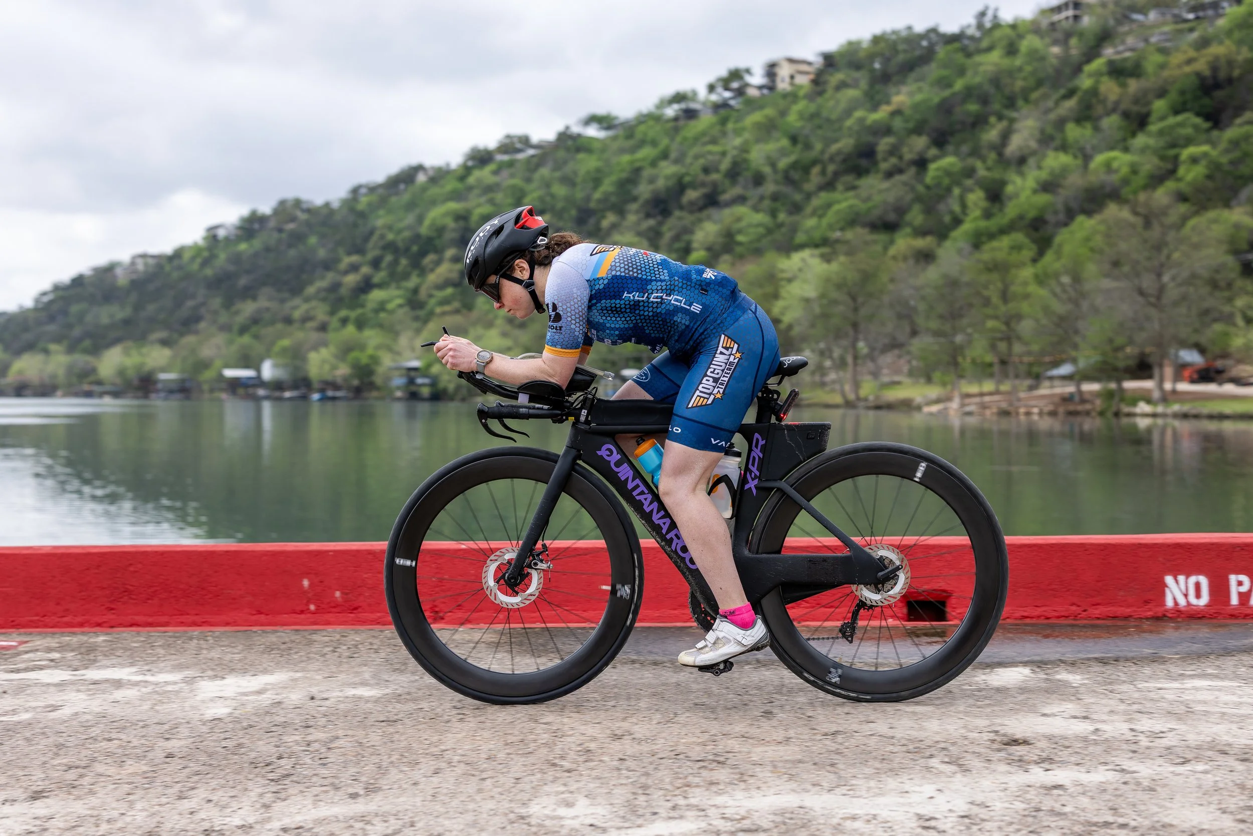 Woman rides her triathlon bike outside of Boston