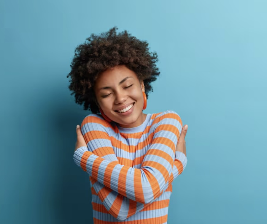 woman hugging self.png