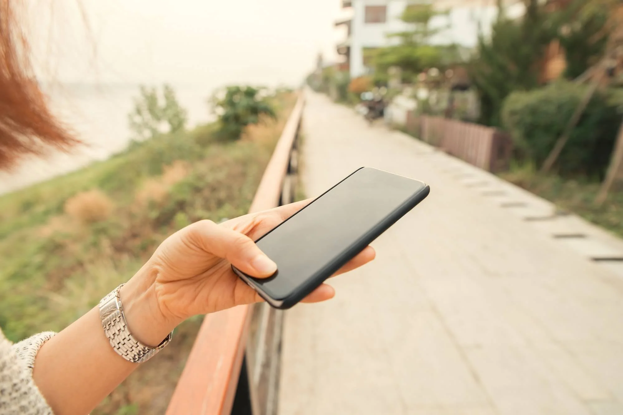 Hands holding a smartphone during everyday use