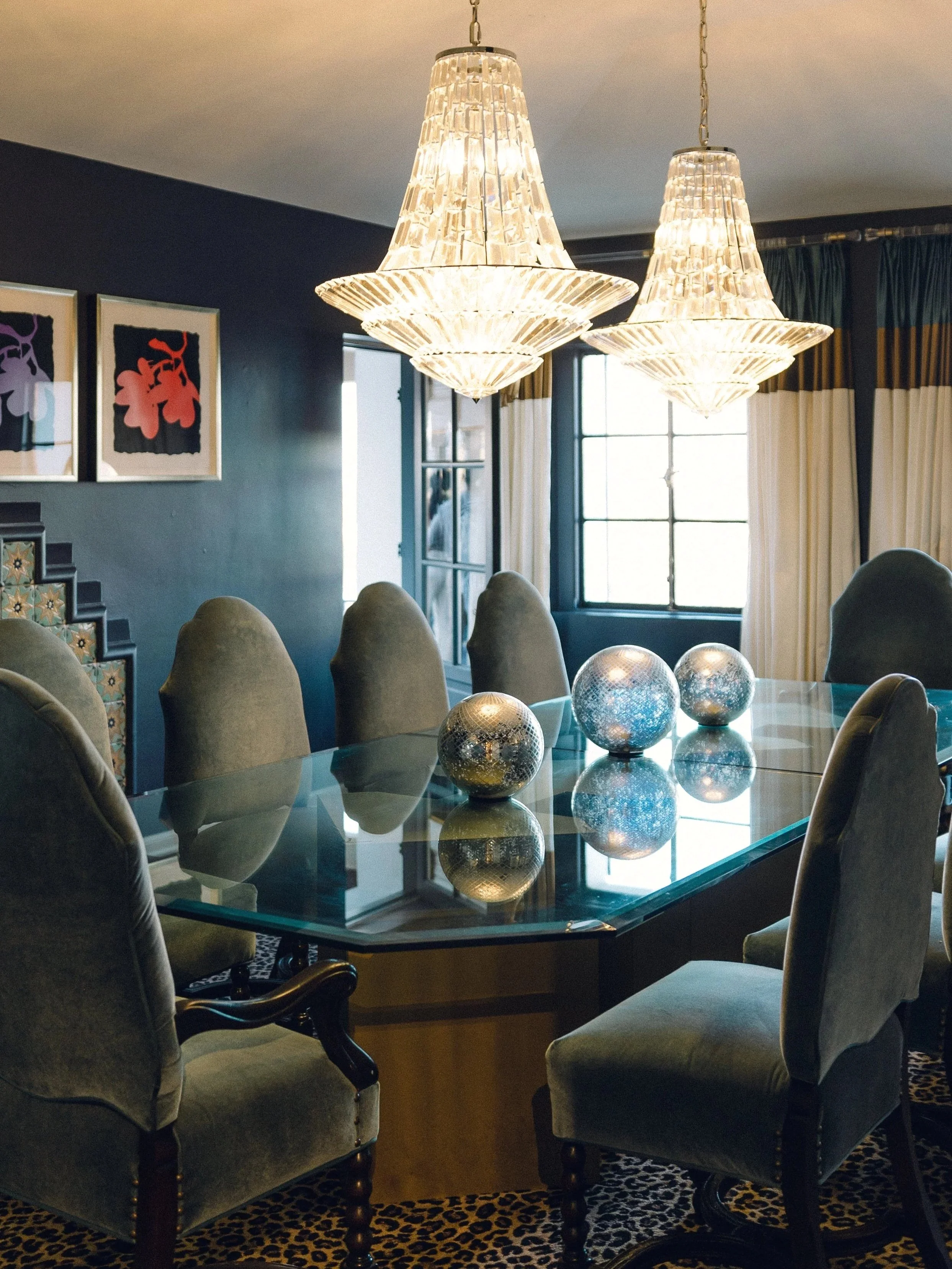 The Pasadena Room has a modern twist with original art by Geordie Homel gracing the walls. It features a balcony overlooking Camelback Mountain and city views. 