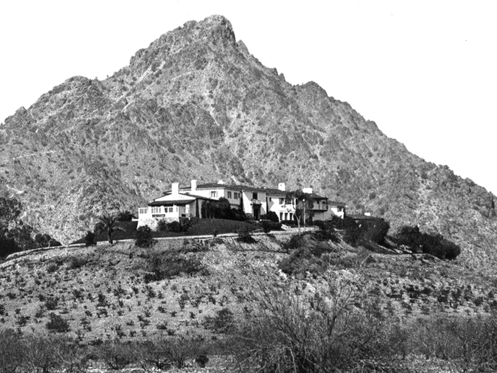 Historic black-and-white view of Wrigley Mansion above the Phoenix foothills
