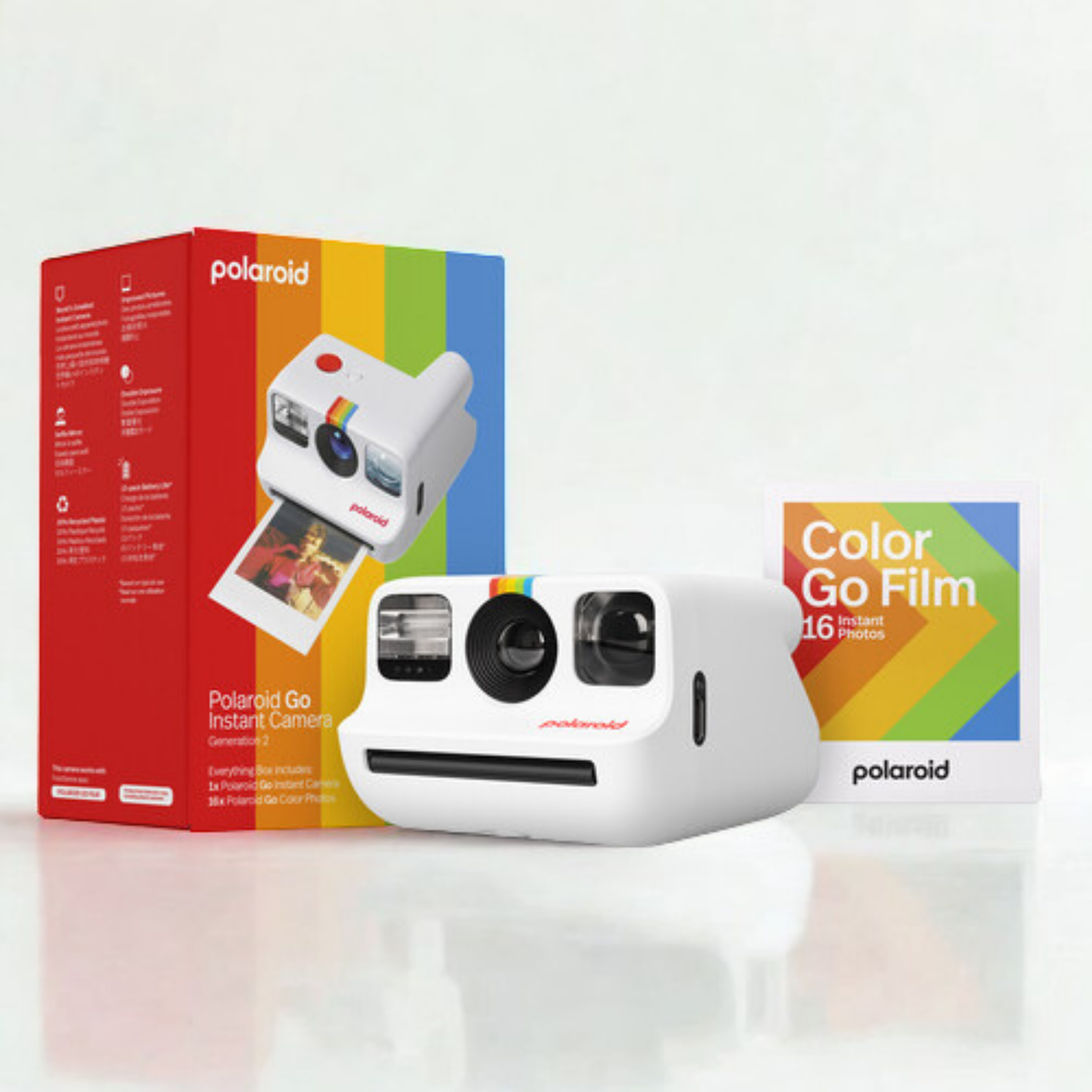Polaroid Go instant camera package with multicolor rainbow stripes and images of the camera and photos on white background.