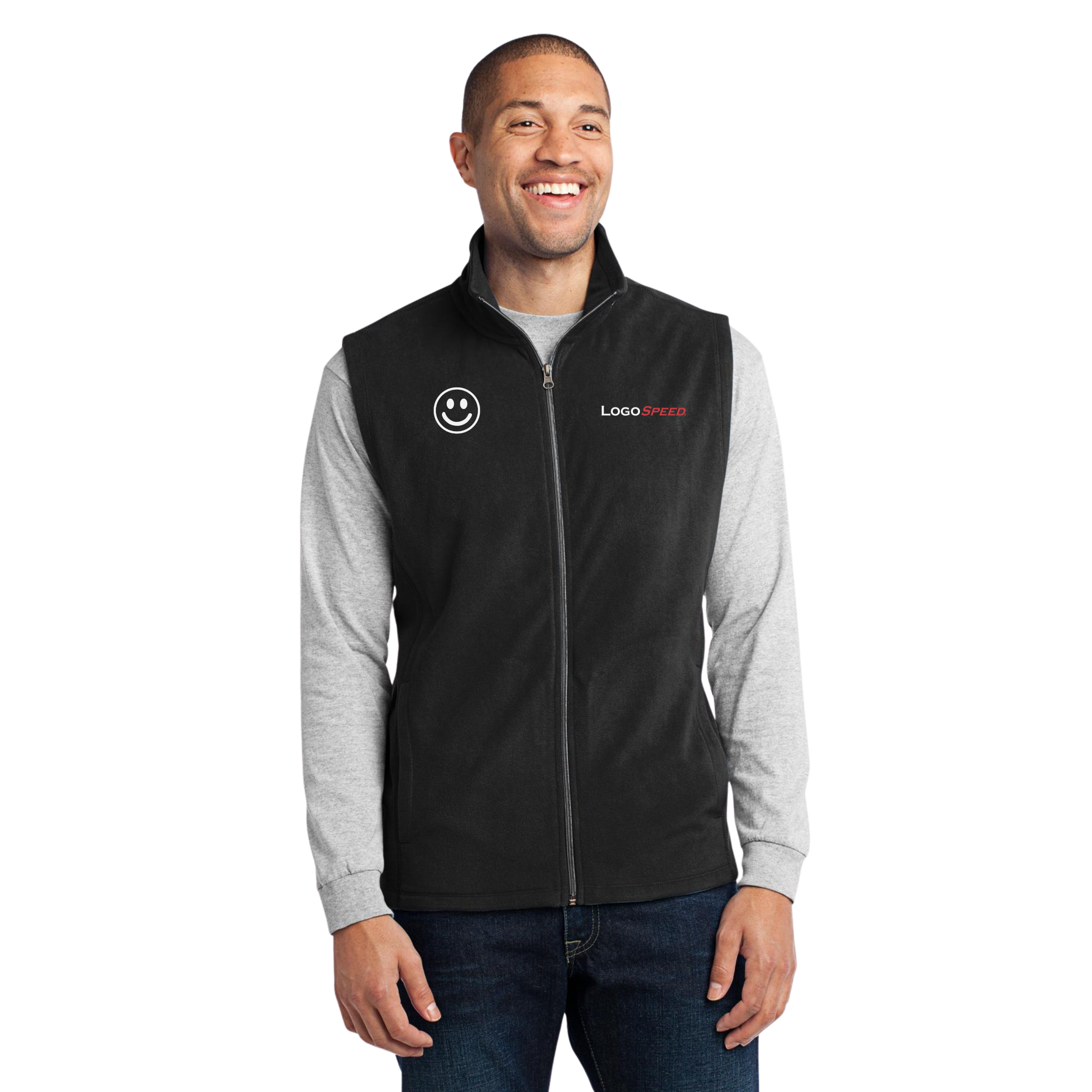 A young man smiling, wearing a gray long sleeve shirt and a black zip-up vest with a smiley face logo and the words 'LOGO SPEED' embroidered on the front.