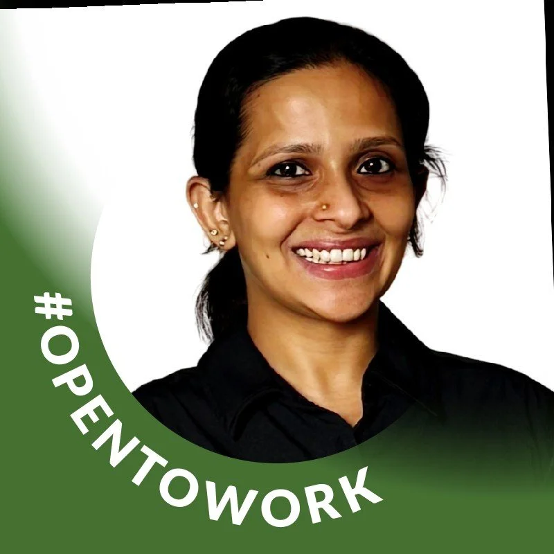 Amrutha's profile picture: Smiling woman with earrings, wearing a black shirt, in front of a white background with a green circular banner that says '#OPENTOWORK'.