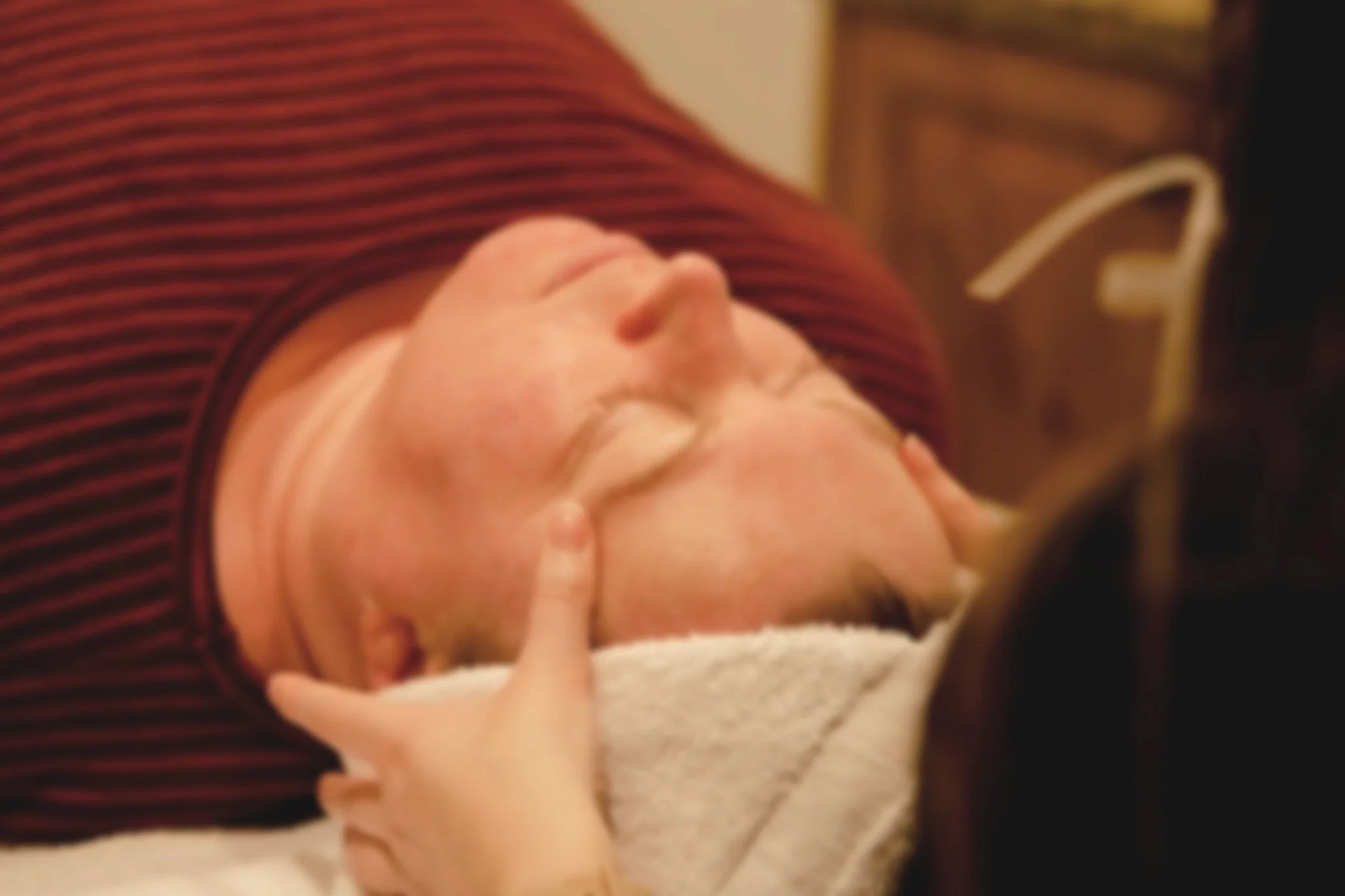 Woman getting facial massage