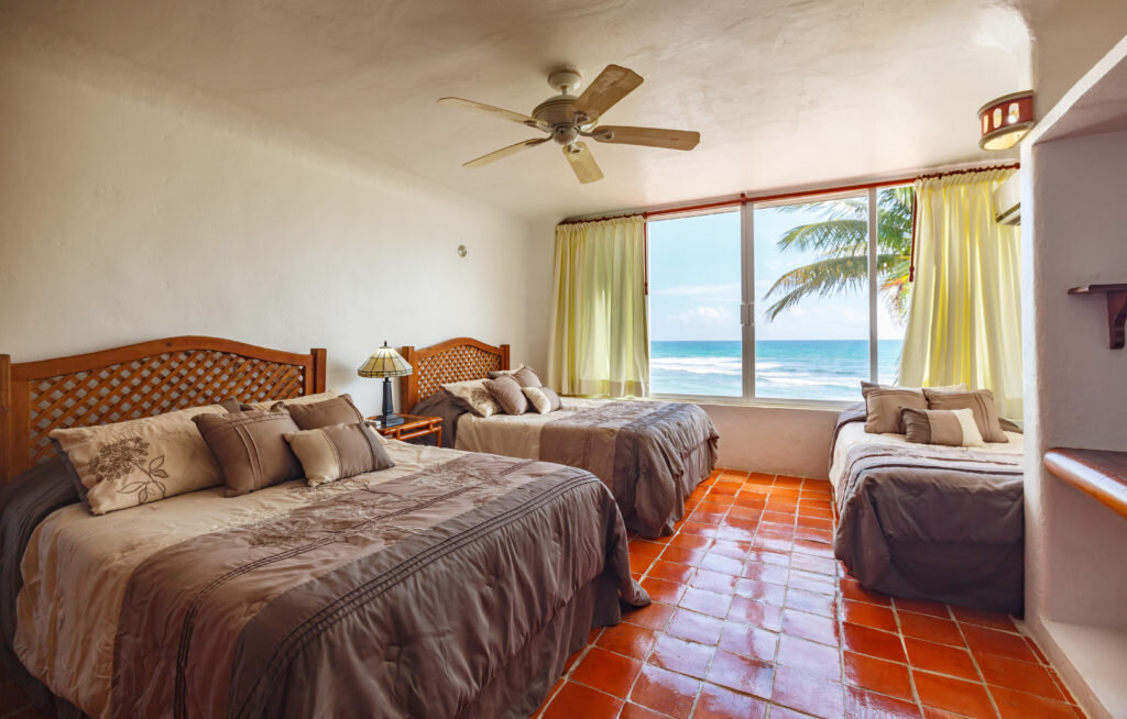 Villa_Balam_Ek_guest_bedroom_with_queen_beds_.jpg