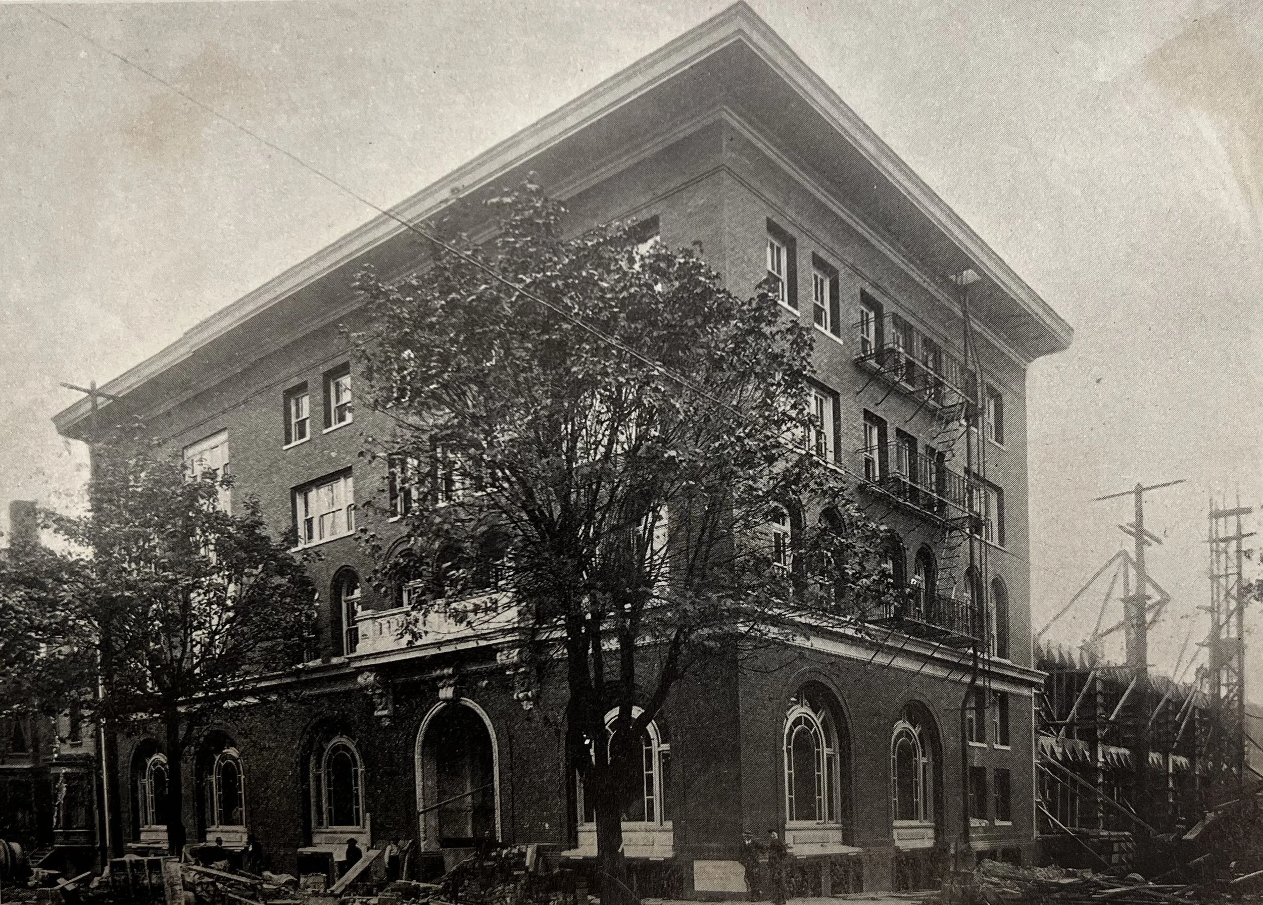 A four-story brick building with white-trimmed windows - the YWCA's new building on SW Broadway and Taylor.