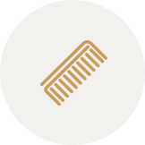 Icon of a brown comb on a white circular background.