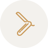 Icon of a straight razor on a white circular background.