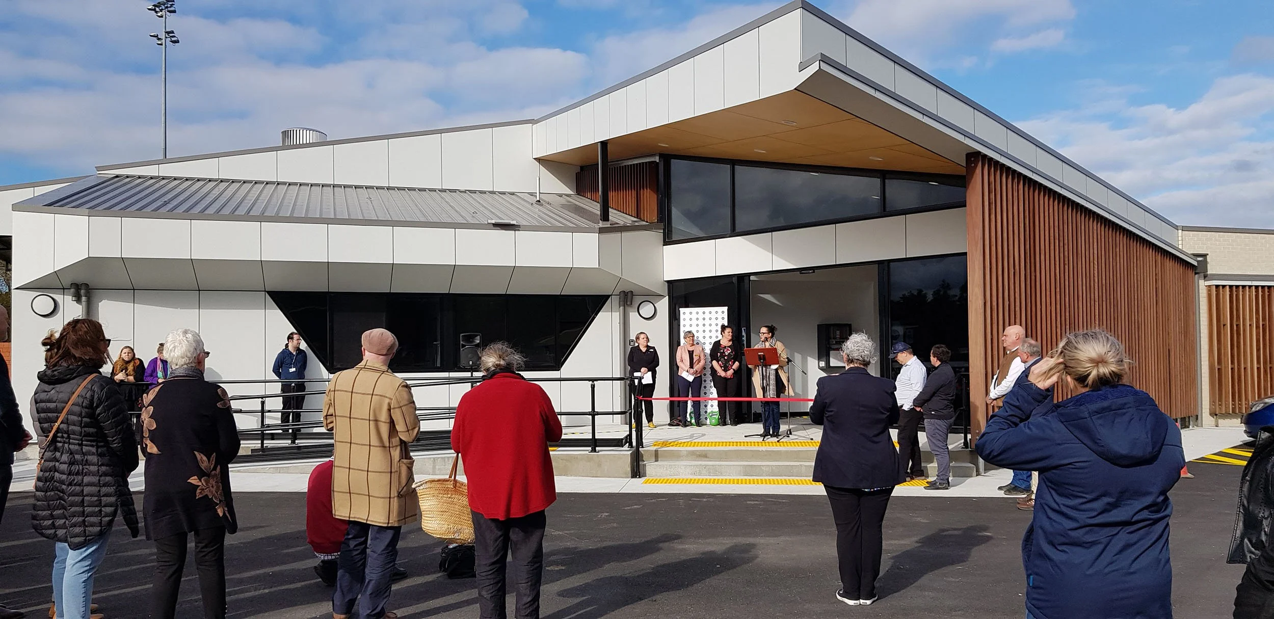 Foster Community Sport Stadium, architecturally designed, angled exterior walls, timber screen, plywood soffit
