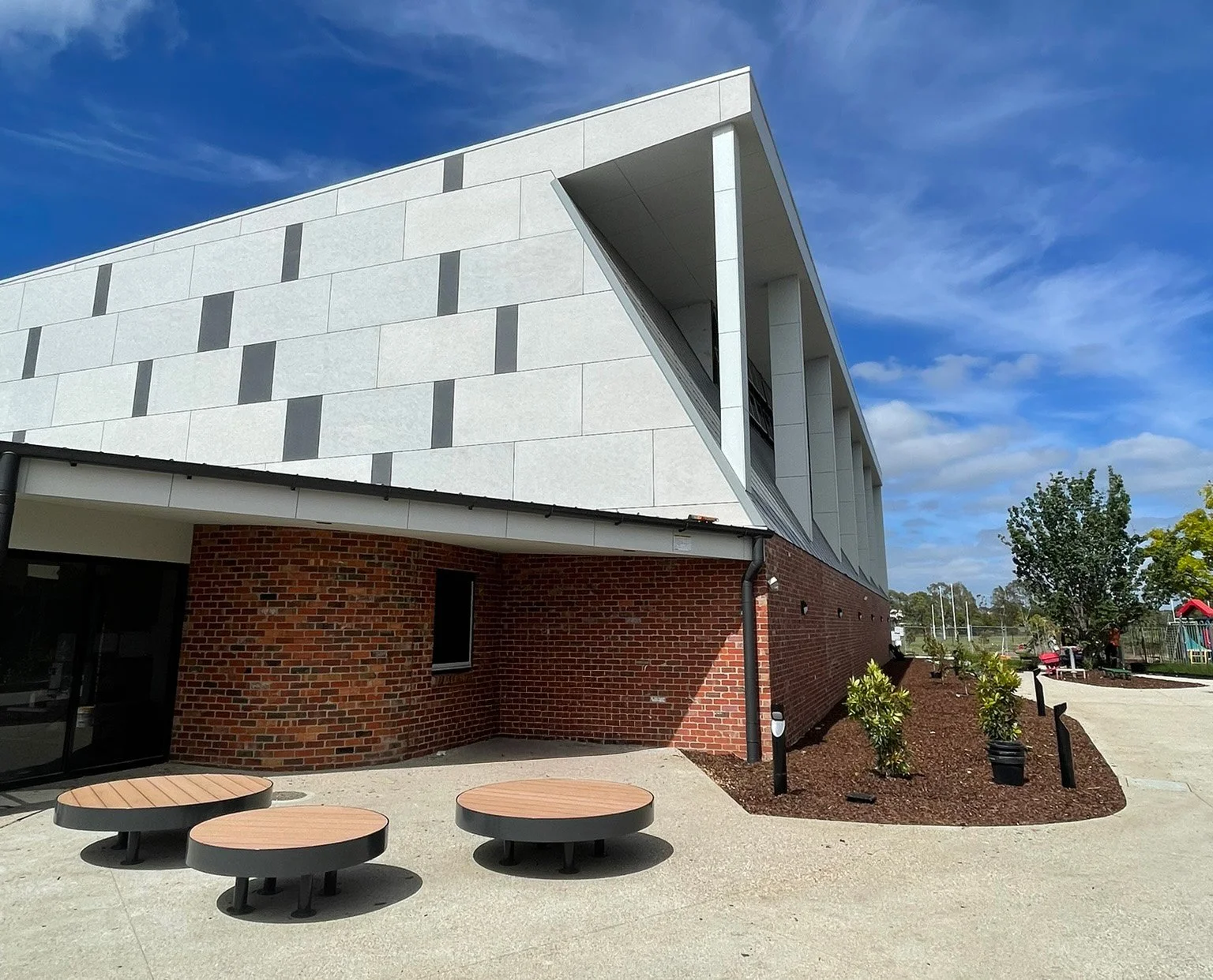 Jamieson Way Community Sports Hall exterior with recyled bricks and concrete look facade cladding