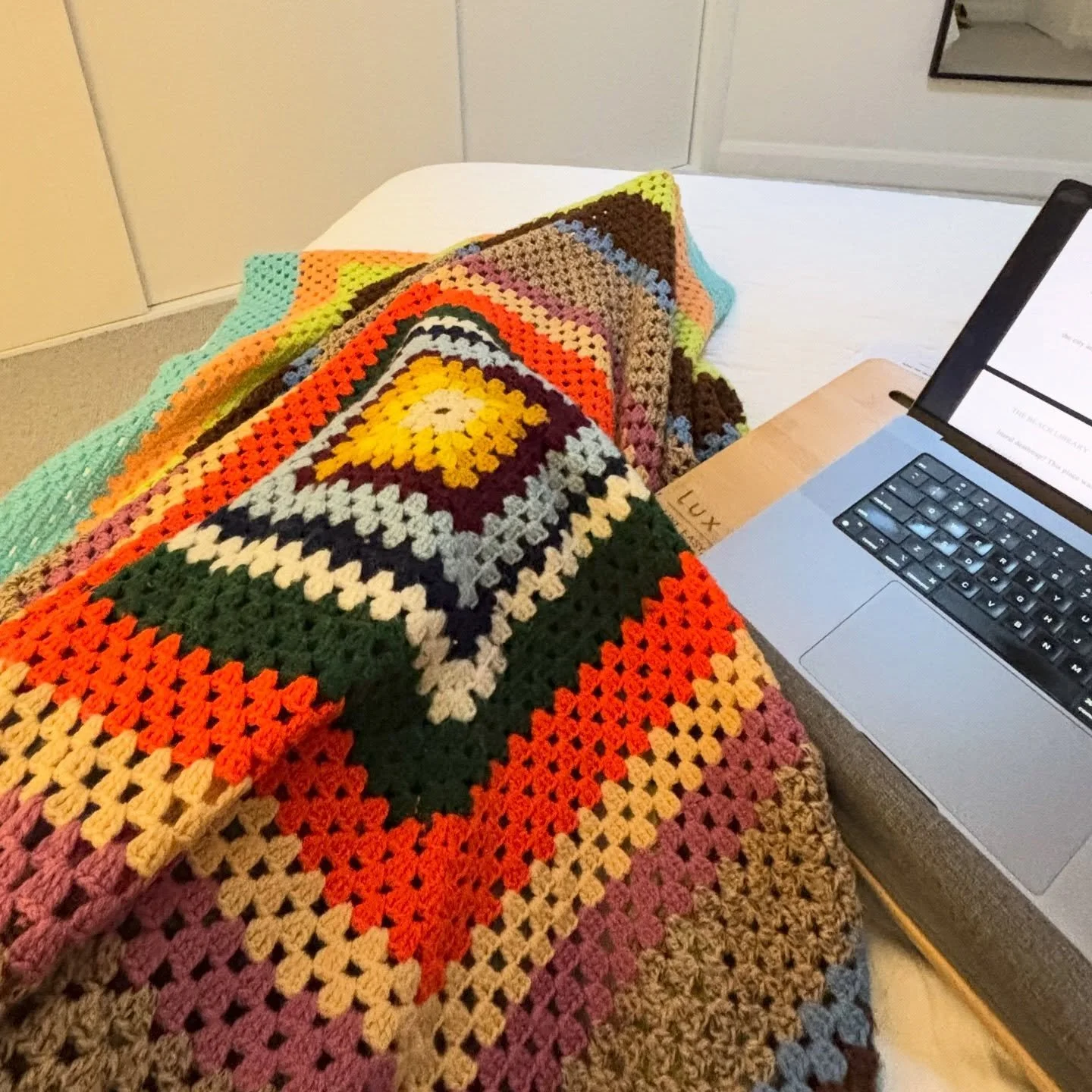 I'm feeling a bit under the weather today so I'm resting on my bed under this beautiful crocheted blanket. It's like having a hug from my talented daughter who made it. The bright colours are making me feel better already.