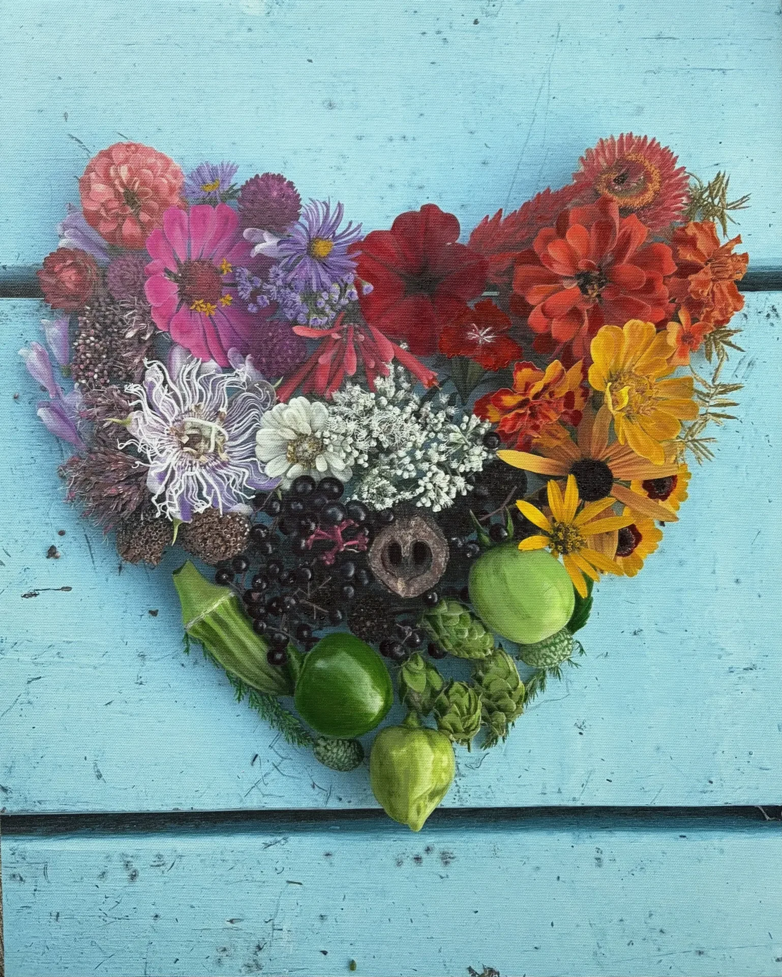 Heart-shaped ephemeral artwork made from colorful flowers, fruit, and natural materials by Chiara D’Amore