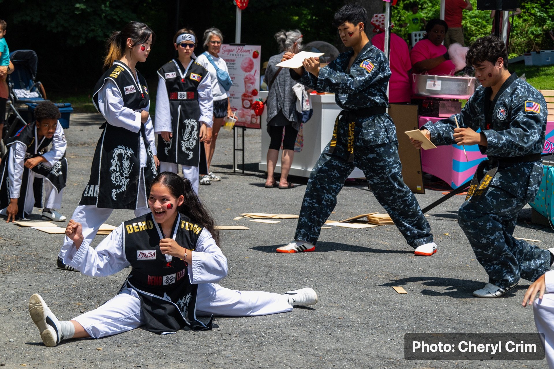 Martial arts performers demonstrating outdoors during the Strawberry Festival.