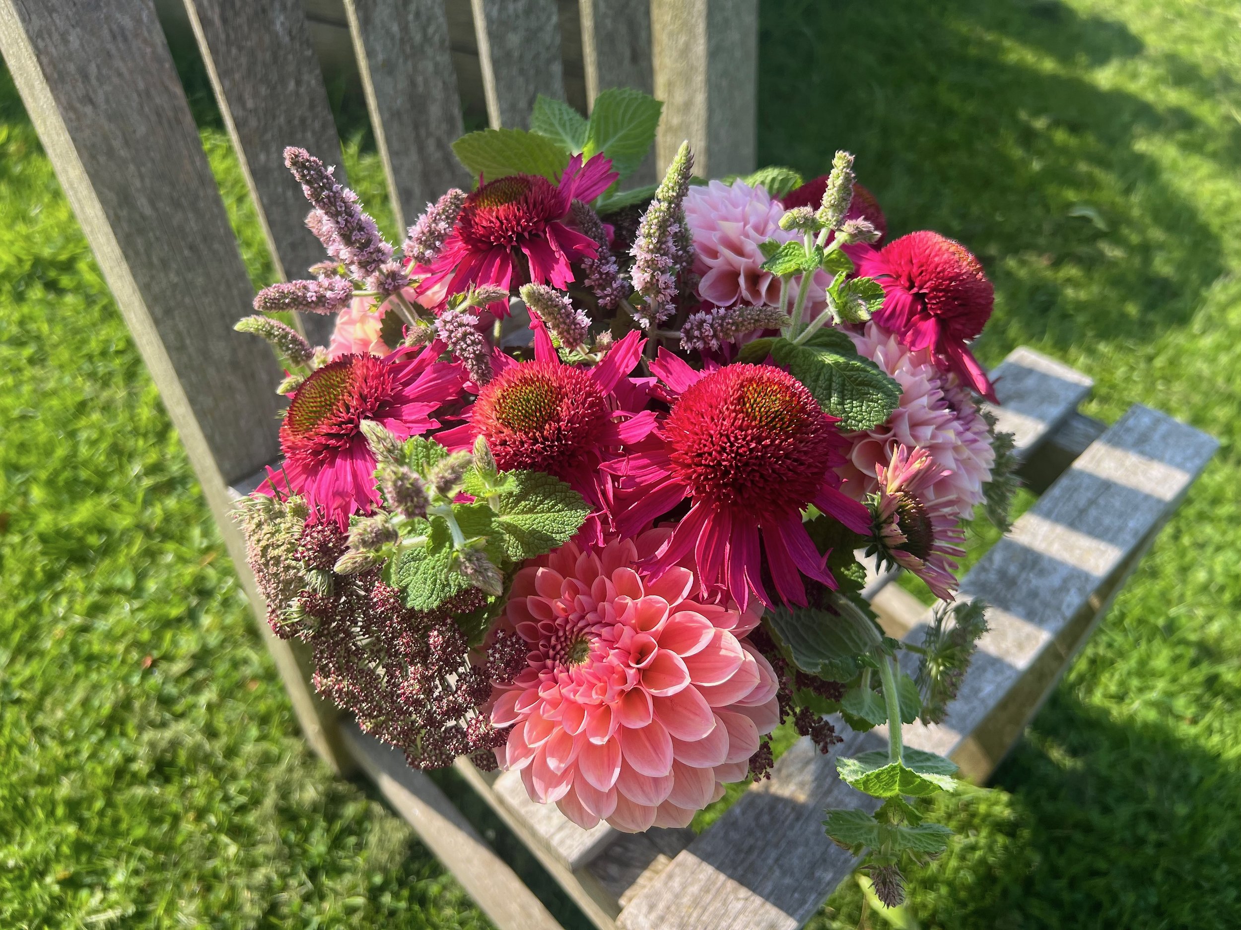 Jam jar flowers in reds and pinks
