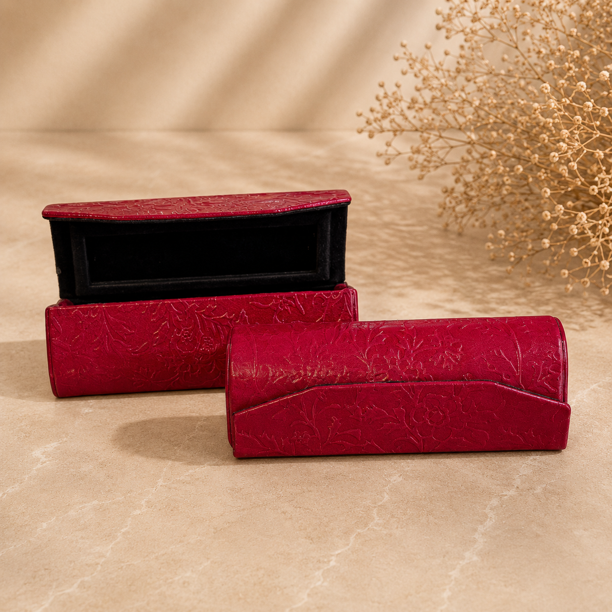 Elegant Red Embossed Cases on Marble.png