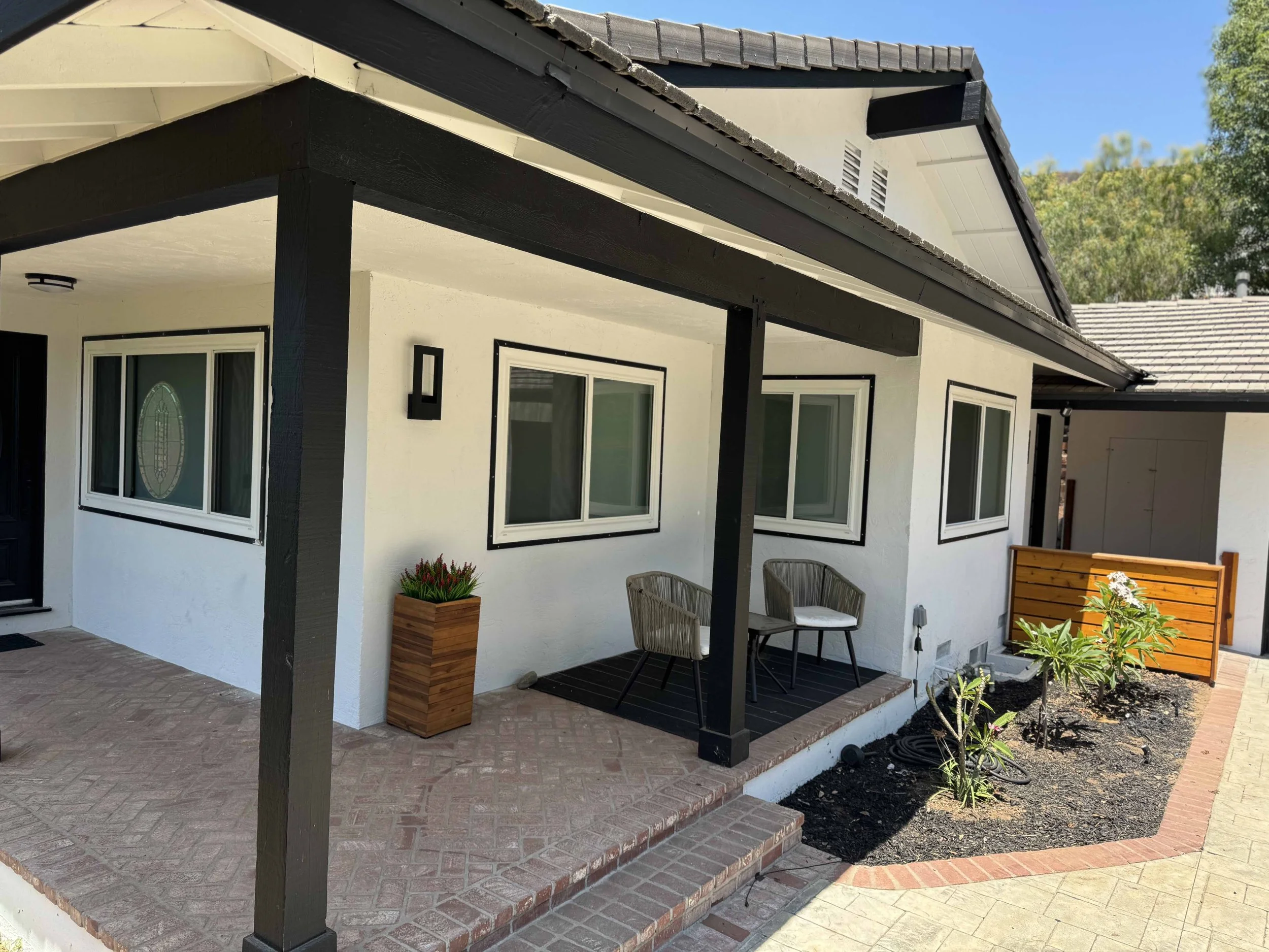 Wood window trim added to enhance the look of existing vinyl windows. 