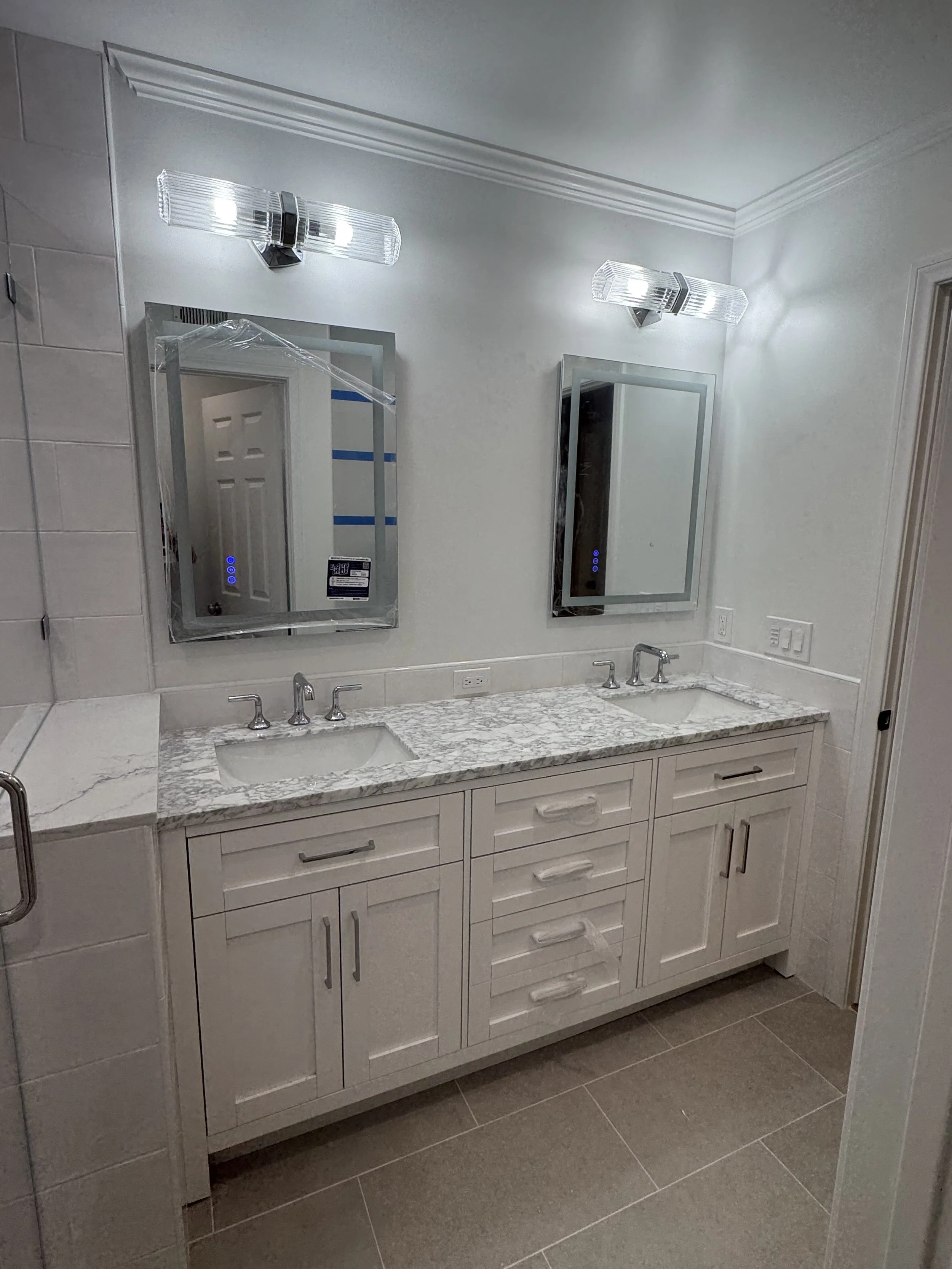 This Thousand Oaks bathroom remodel used a manufactured vanity that came with a quartz top and backsplash. These manufactured vanity's are a great way to save money while providing a custom look and feel. 